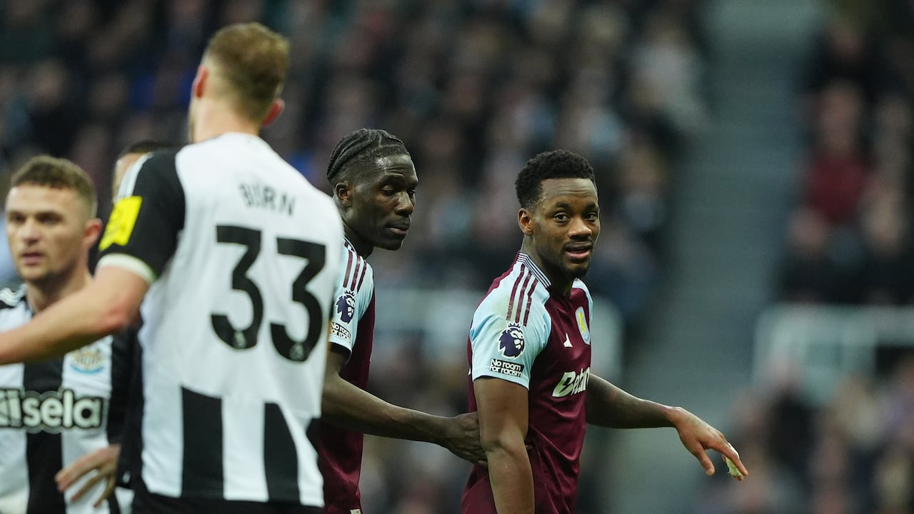 *Re-transmitting correcting colour of card to red* Aston Villa's Jhon Duran (second from right) is shown a yellow card by referee Anthony Taylor (obscured) during the Premier League match at St. James' Park, Newcastle upon Tyne. Picture date: Thursday December 26, 2024. (Photo by Owen Humphreys/PA Images via Getty Images)