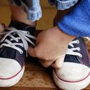 Child's hands tyeing sport shoes.More of this & other kids atBEING A KID LIGHTBOX