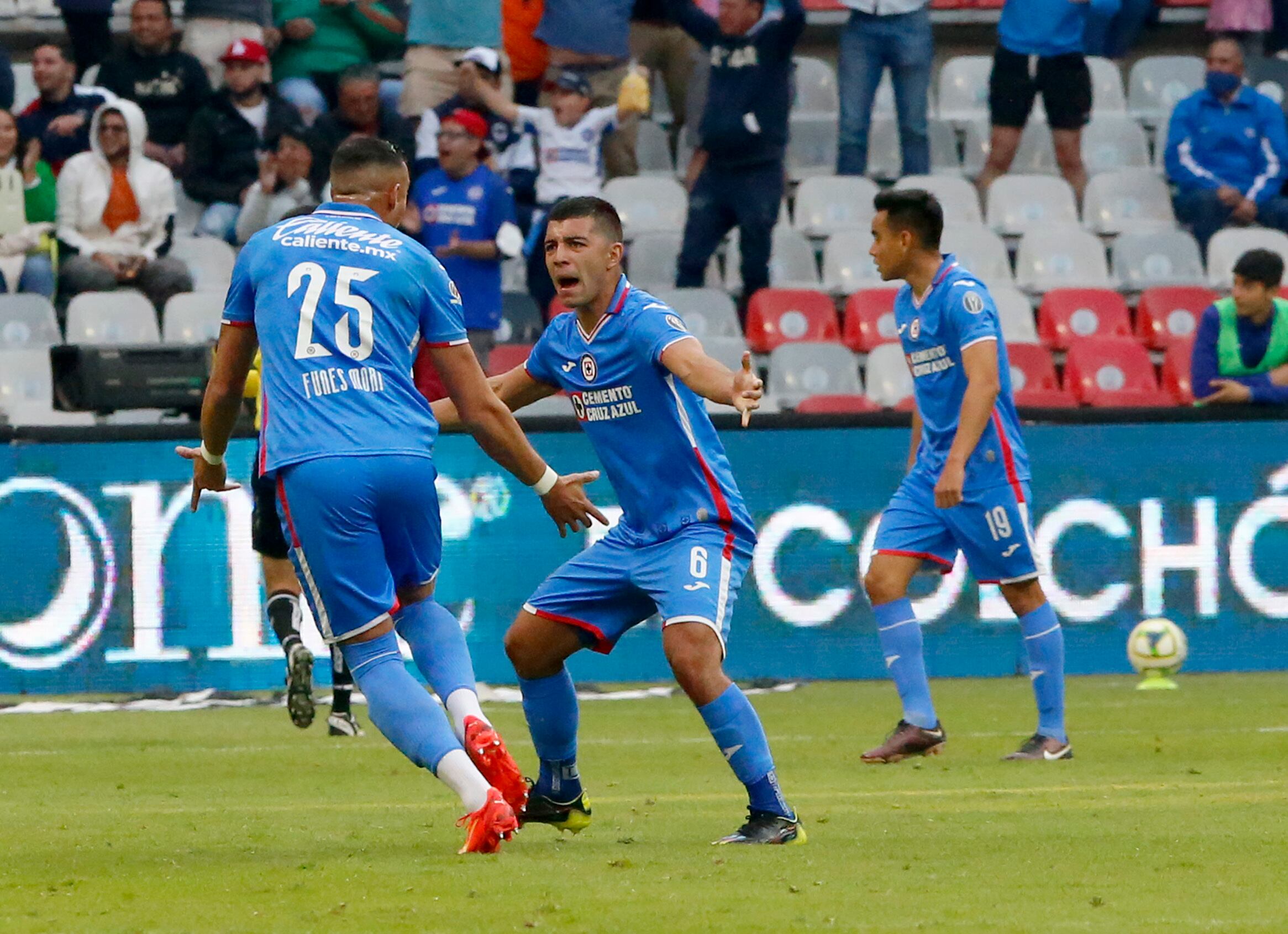 Cruz Azul's Ramiro Funes Mori, left, celebrates with teammate Erik Lira, after scoring his team's second goal against Monterrey during a Mexican Soccer League match at Azteca Stadium in Mexico City, Saturday, Jan. 14, 2023. (AP Photo/Tomas Stargardter)