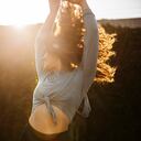 Female dancer enjoying while dancing during sunset