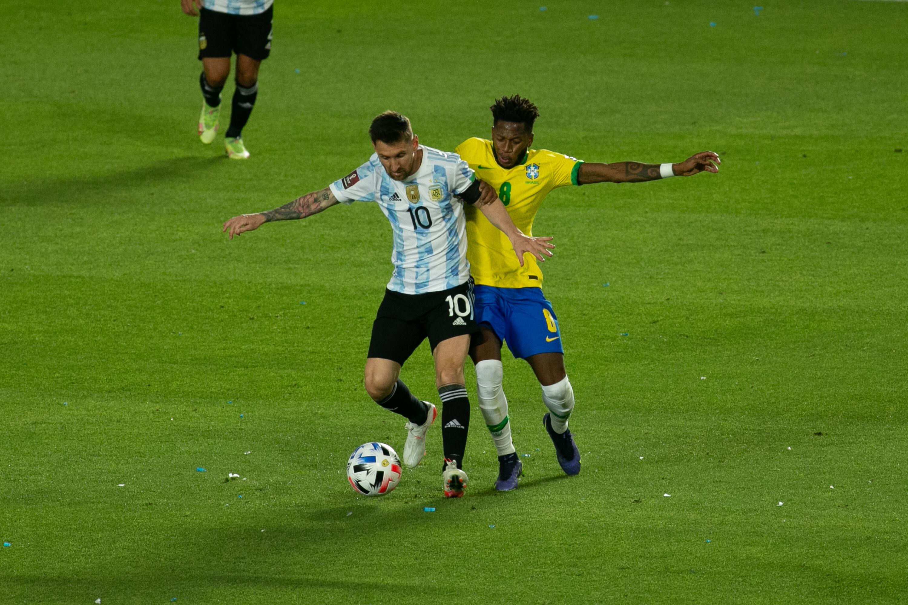 Lionel Messi of Argentina fights for the ball with Fred of Brazil during a match between Argentina and Brazil as part of South American Qualifiers for Qatar 2022 World Cup at San Juan del Bicentenario Stadium on November 16, 2021 in San Juan, Argentina. (Photo by Florencia Tan Jun/PxImages/Icon Sportswire via Getty Images)