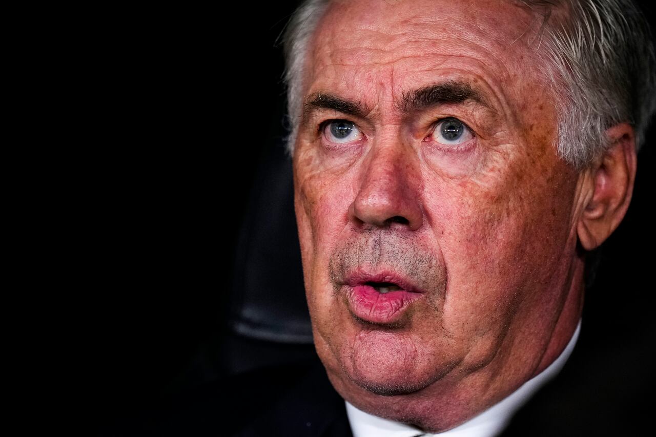 Real Madrid's head coach Carlo Ancelotti sits at the bench prior to the Champions League opening phase soccer match between Real Madrid and Borussia Dortmund at the Santiago Bernabeu stadium in Madrid, Tuesday, Oct. 22, 2024. (AP Photo/Manu Fernandez)