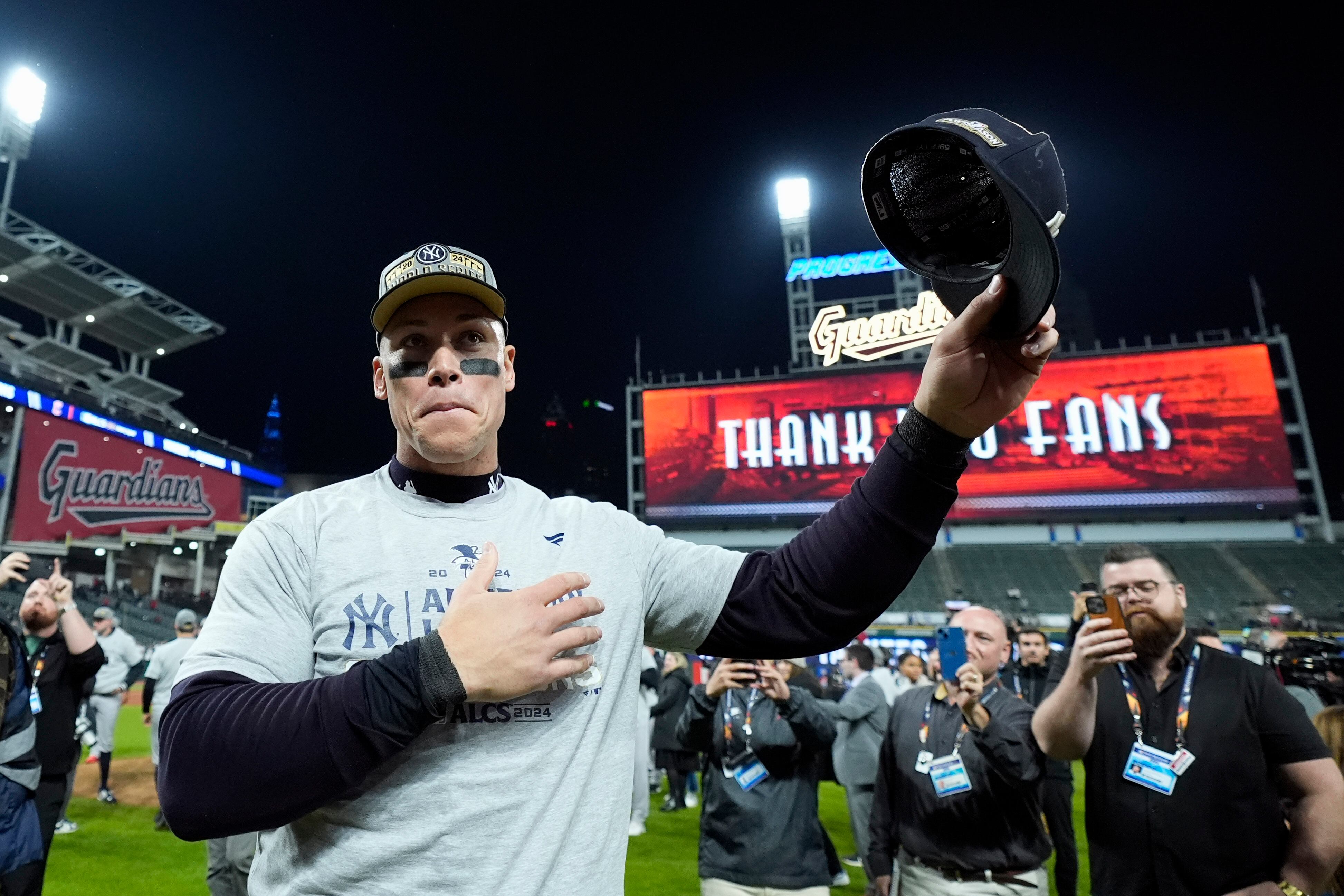 New York Yankees' Aaron Judge celebrates after Game 5 of the baseball AL Championship Series against the Cleveland Guardians Saturday, Oct. 19, 2024, in Cleveland. The Yankees won 5-2 to advance to the World Series. (AP Photo/Godofredo A. Vásquez )