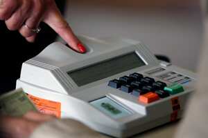 A woman prepares to cast her vote during the legislative and presidential election, in Sao Paulo, Brazil, on October 2, 2022. - Voting began early Sunday in South America's biggest economy, plagued by gaping inequalities and violence, where voters ar expected to choose between far-right incumbent Jair Bolsonaro and leftist front-runner Luiz Inacio Lula da Silva, any of which must garner 50 percent of valid votes, plus one, to win in the first round. (Photo by Miguel Schincariol / AFP)