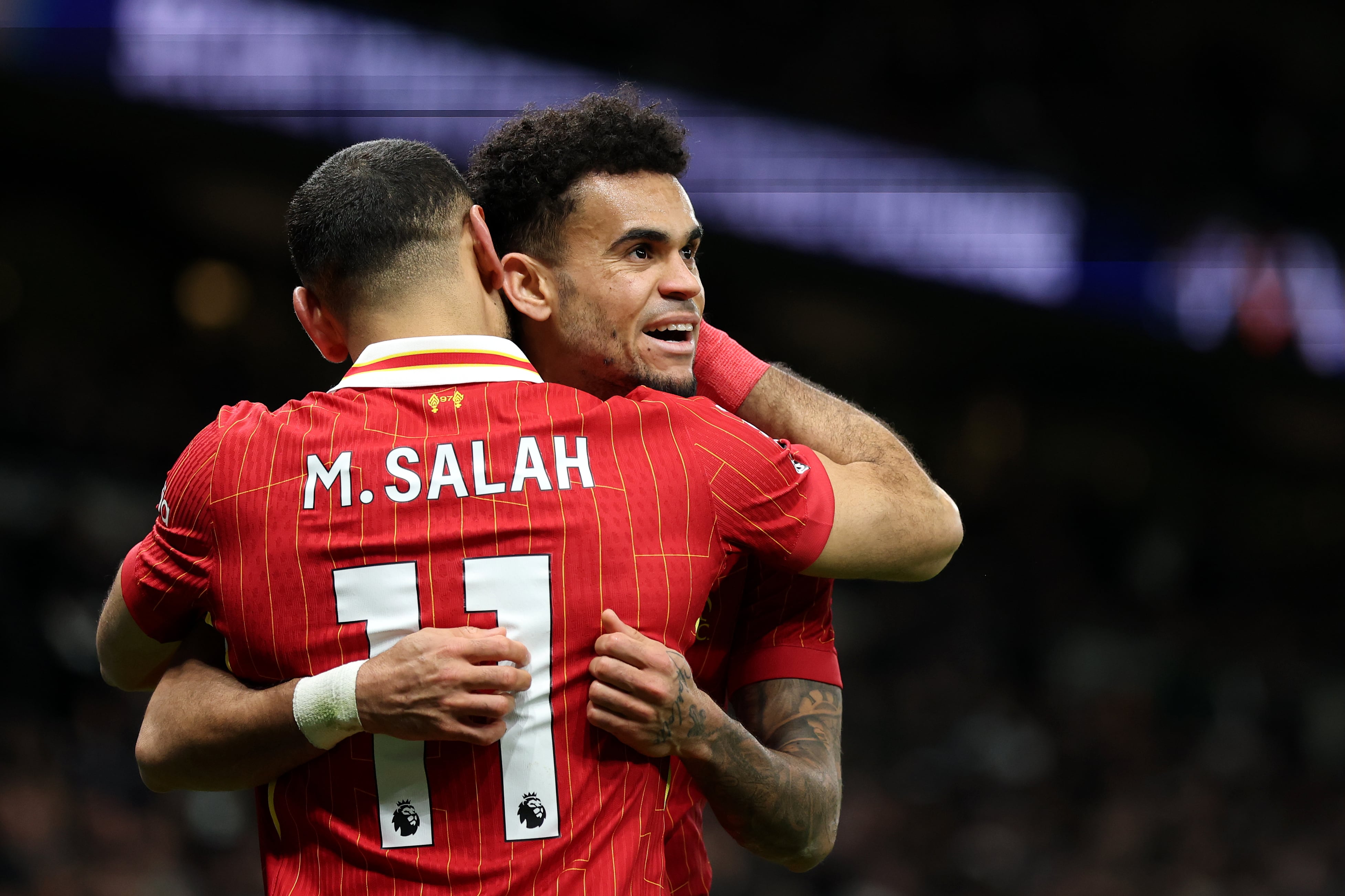 LONDON, ENGLAND - DECEMBER 22: Luis Diaz of Liverpool celebrates scoring his sides sixth goal with team mate Mohamed Salah during the Premier League match between Tottenham Hotspur FC and Liverpool FC at Tottenham Hotspur Stadium on December 22, 2024 in London, England. (Photo by Alex Pantling/Getty Images)