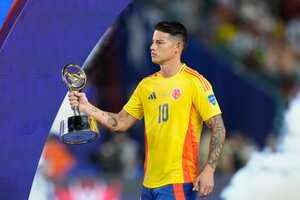 Colombia's James Rodriguez holds the Best Player of the tournament trophy after the Copa America final soccer match against Argentina in Miami Gardens, Fla., Monday, July 15, 2024. Argentina won 1-0 in extra time. (AP Photo/Wilfredo Lee)