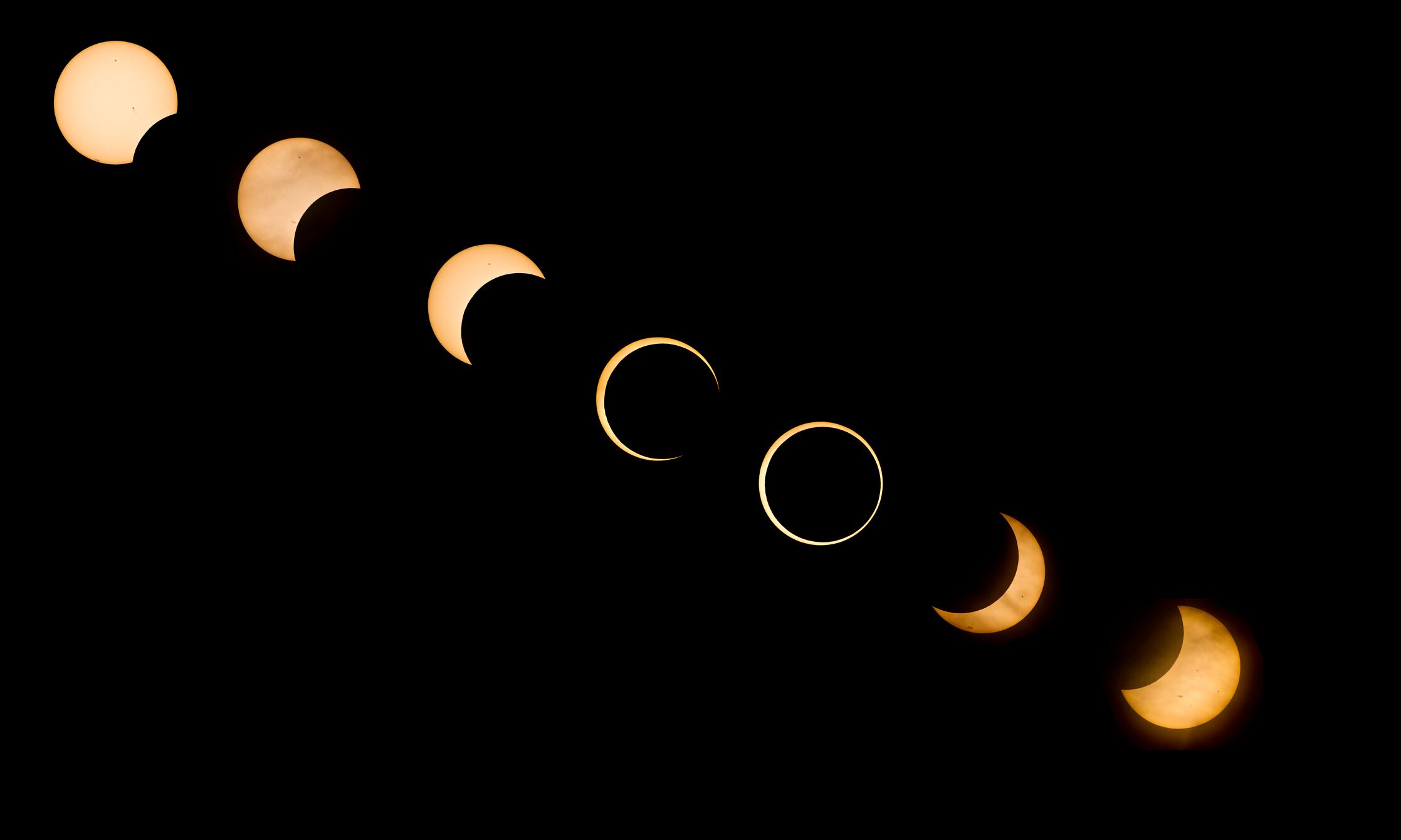 USA, California, Redding, Digital composite view of annular solar eclipse on May 20, 2012. Seven separate exposures were made twenty minutes apart and combined into one image.