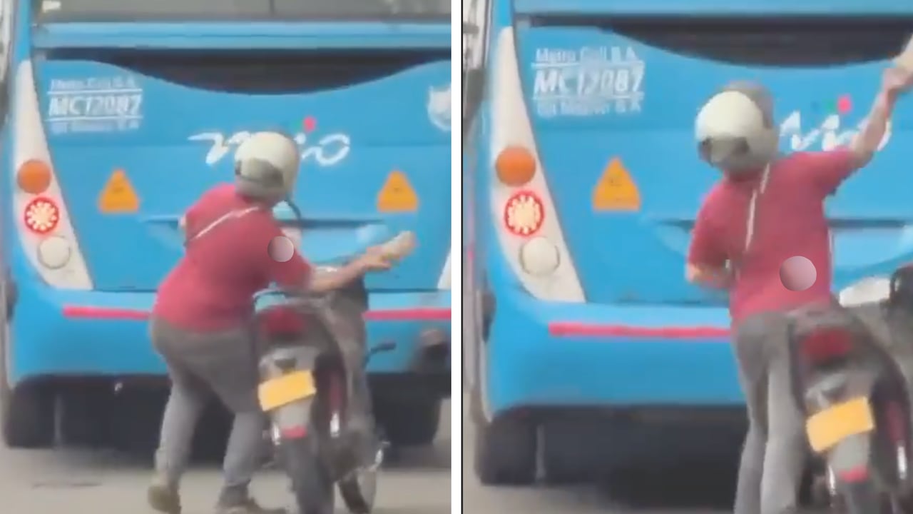 Hombre lanzando un ladrillo contra bus del MIO en Cali el miércoles 14 de octubre