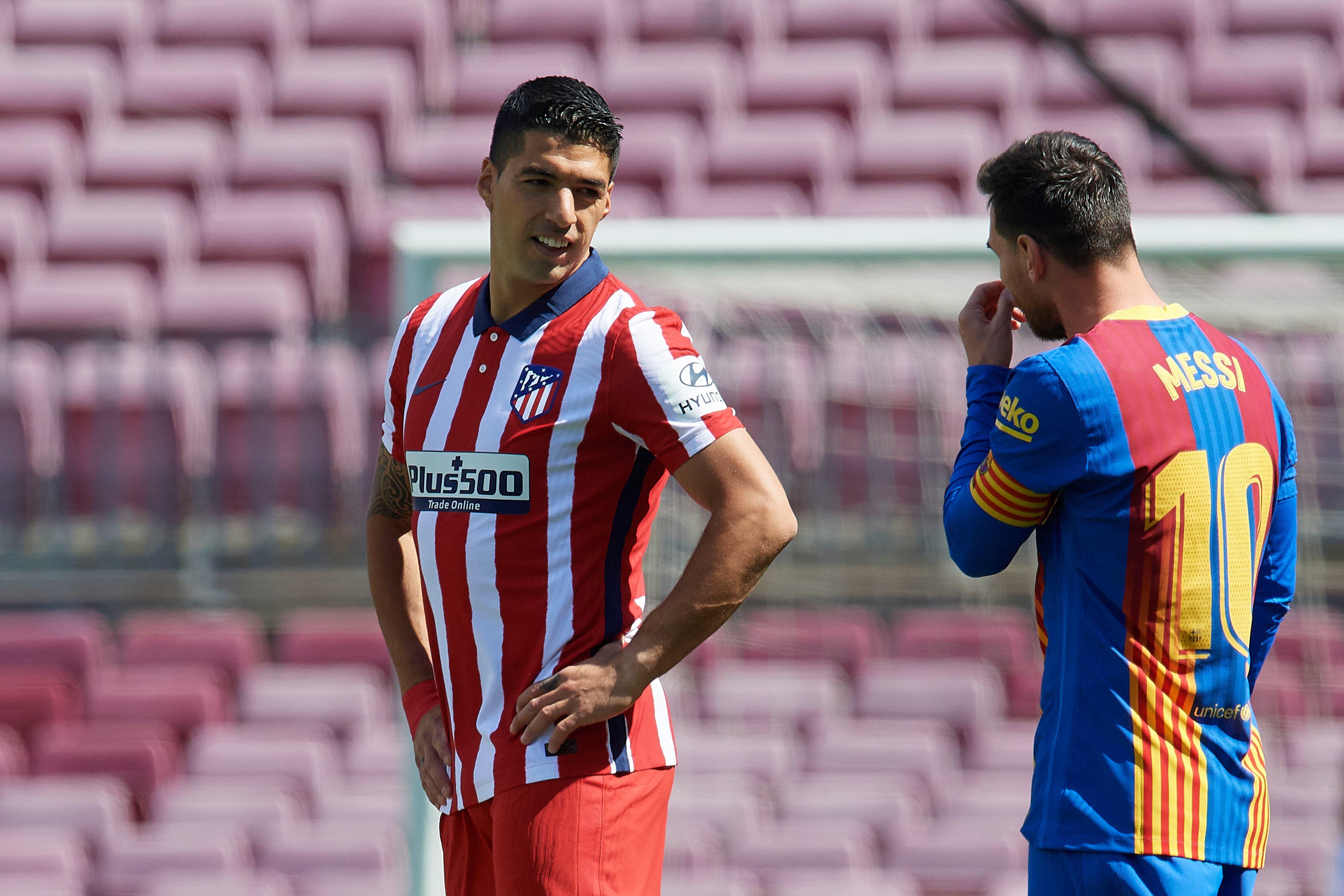 Luis Suarez of Atletico Madrid and Lionel Messi of Barcelona  wlaks prior to the La Liga Santander match between FC Barcelona and Atletico de Madrid at Camp Nou on May 8, 2021 in Barcelona, Spain. Sporting stadiums around Spain remain under strict restrictions due to the Coronavirus Pandemicwaving to fansGovernment social distancing laws prohibit fans inside venues resulting in games being played behind closed doors. (Photo by Jose Breton/Pics Action/NurPhoto via Getty Images)