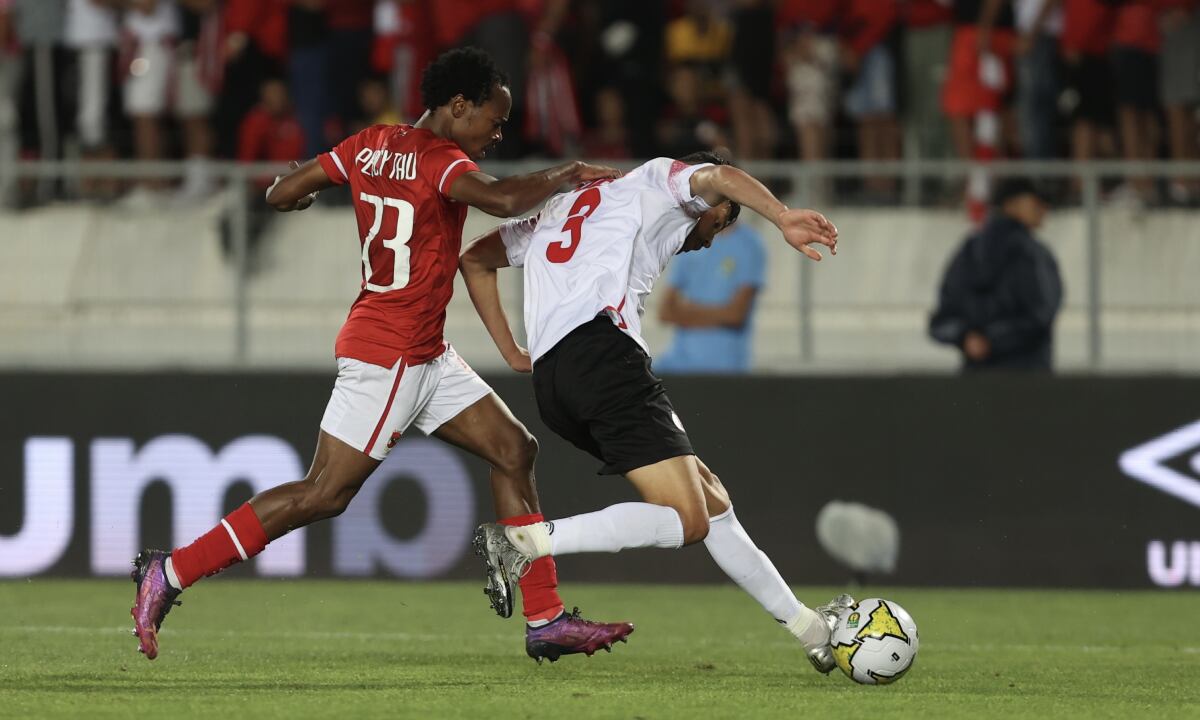 CASABLANCA, MOROCCO - MAY 30: Achraf Dari (R) of Wydad Casablanca in action against Percy Tau (L) of Al Ahly during the CAF Champions League final match between Al Ahly and Wydad Casablanca at Stade Mohammed V in Casablanca, Morocco on May 30, 2022. (Photo by Getty Images/Adam Haneen/Anadolu Agency)