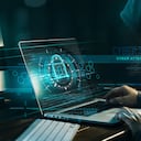 Cyber security concept. Internet crime. Hacker working on a code and network with lock icon on digital interface virtual screen dark digital background.