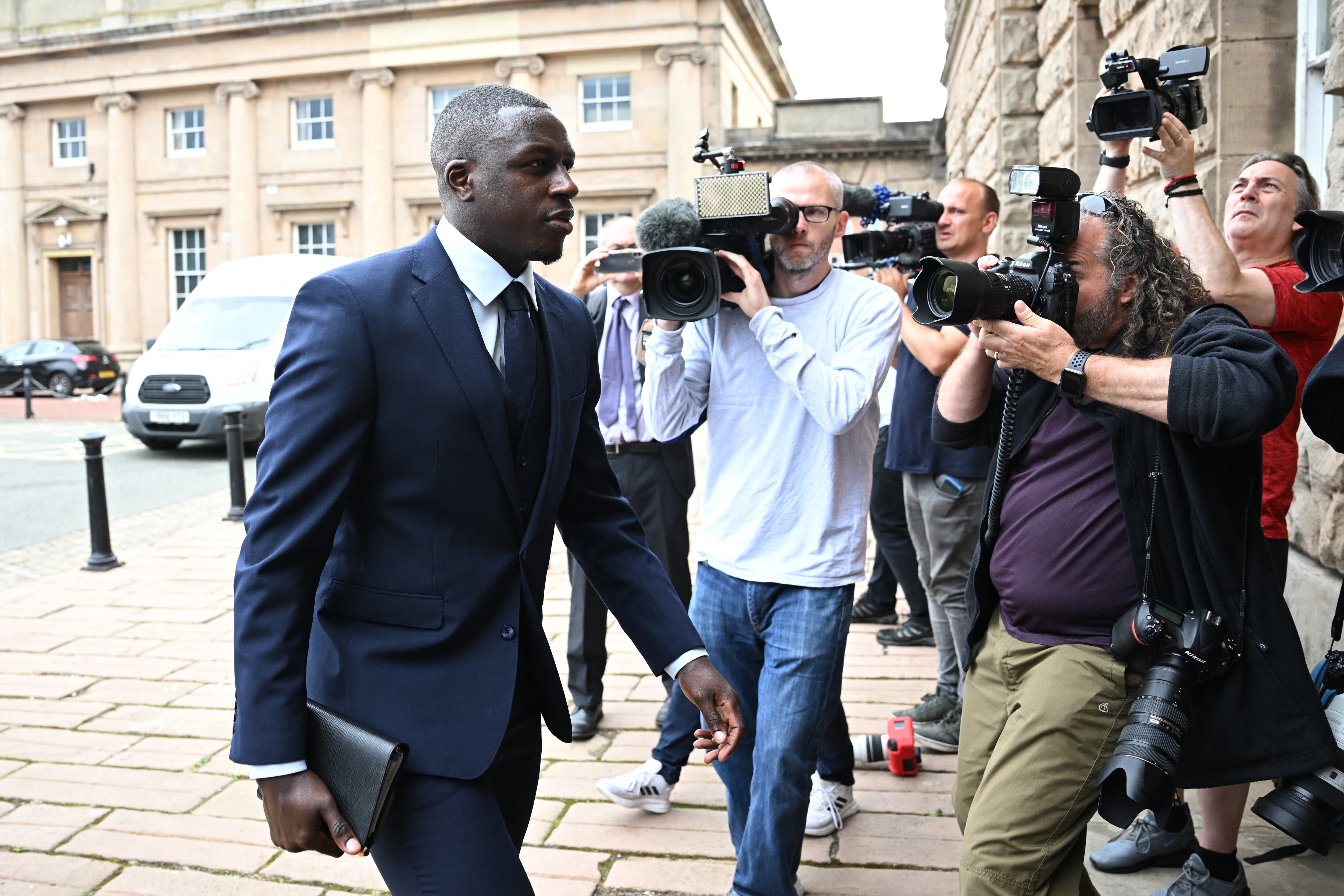 (FILES) In this file photo taken on August 15, 2022 Manchester City and France footballer Benjamin Mendy arrives to Chester Crown Court in northwest England during his trial for a string of sexual offences including rape, attempted rape and sexual assault. - A jury in the UK on January 13, 2023 cleared Mendy of six counts of rape and one of sexual assault against four women, following a six-month trial. (Photo by Paul ELLIS / AFP)