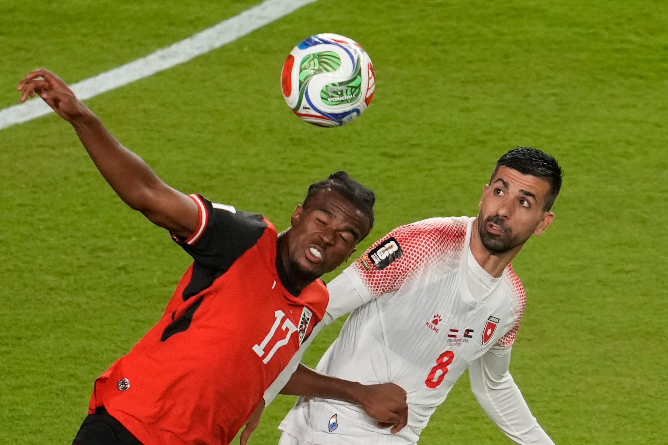 Austria's Carney Chukwuemeka, left, and Jordan's Noor Alrawabdeh go for a header during the World Cup Group J soccer match in Santa Clara, Calif., near San Francisco, Tuesday, June 16, 2026. (AP Photo/Jeff Chiu)