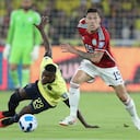 Colombia's Matheus Uribe, right, dribbles past Ecuador's Moises Caicedo during a qualifying soccer match for the FIFA World Cup 2026 at the Rodrigo Paz Delgado stadium in Quito, Ecuador, Tuesday, Oct. 17, 2023. (AP Photo/Patricio Teran)