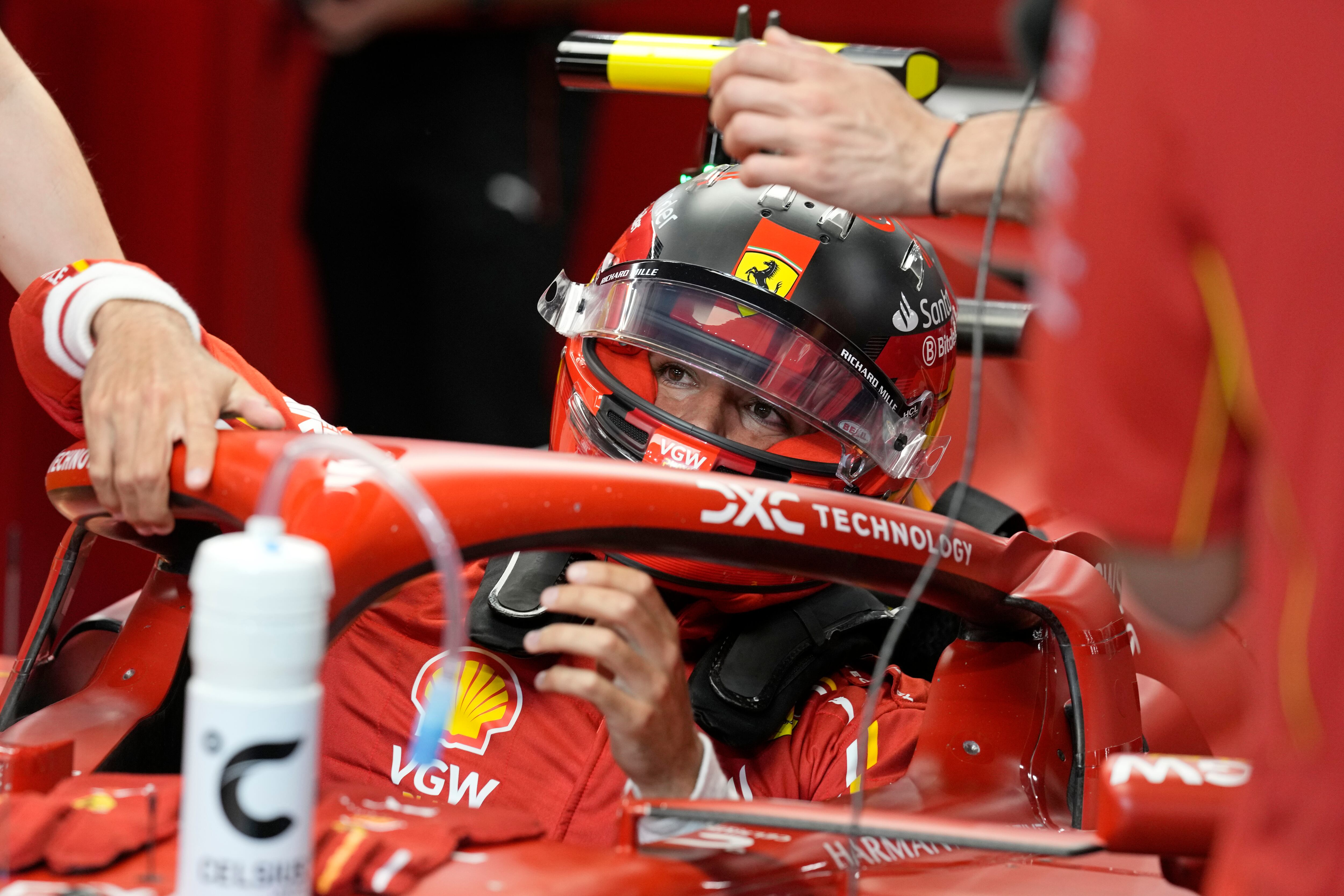 Ferrari driver Carlos Sainz of Spain sits in his car before the start of the second practice session ahead of the Formula One Saudi Arabian Grand Prix at the Jeddah Corniche Circuit in Jeddah, Saudi Arabia, Thursday, March 7, 2024. The Saudi Arabian Grand Prix will be held on Saturday, March 9, 2024. (AP Photo/Darko Bandic)