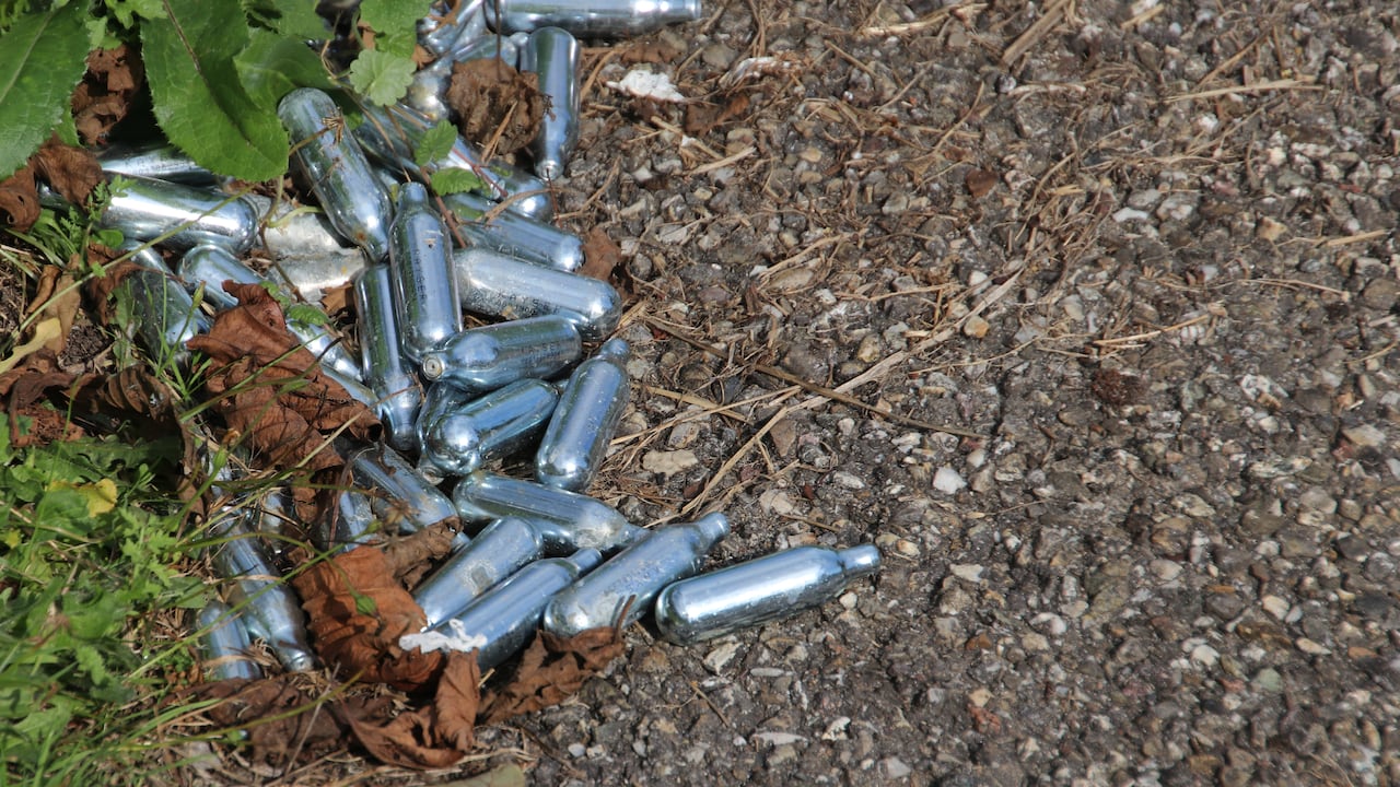 Nitrous oxide patron with balloons used for laughing gas as a drug in the Netherlands