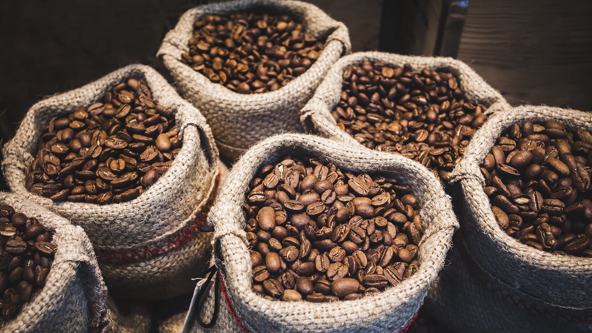 Coffee beans in bags. Fresh coffee beans background.