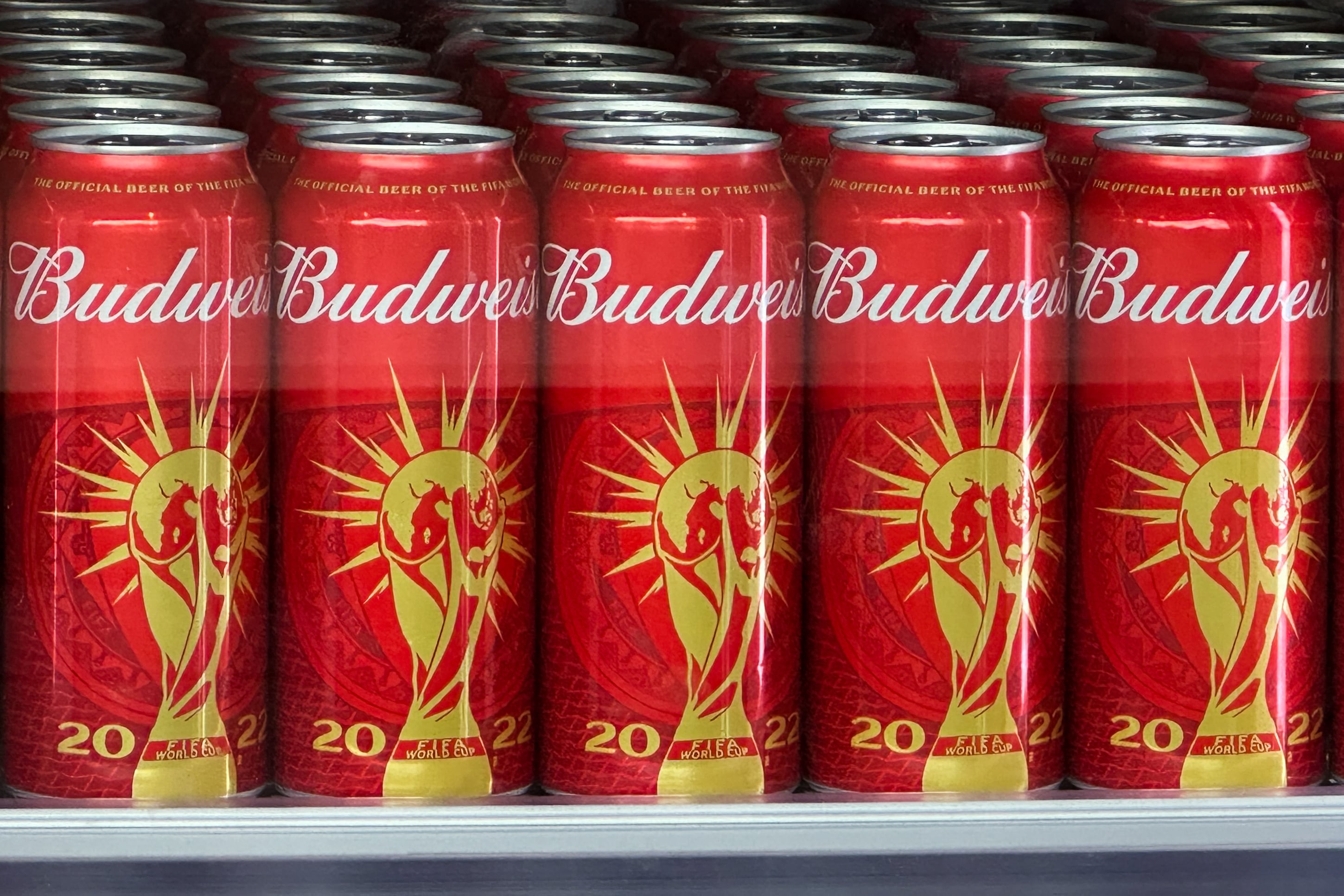 Cans of Budweiser beer featuring the FIFA World Cup logo are displayed in Doha on November 18, 2022 ahead of the Qatar 2022 World Cup football tournament. - The sale of alcohol in Qatar is strictly regulated. (Photo by Patrick T. FALLON / AFP)