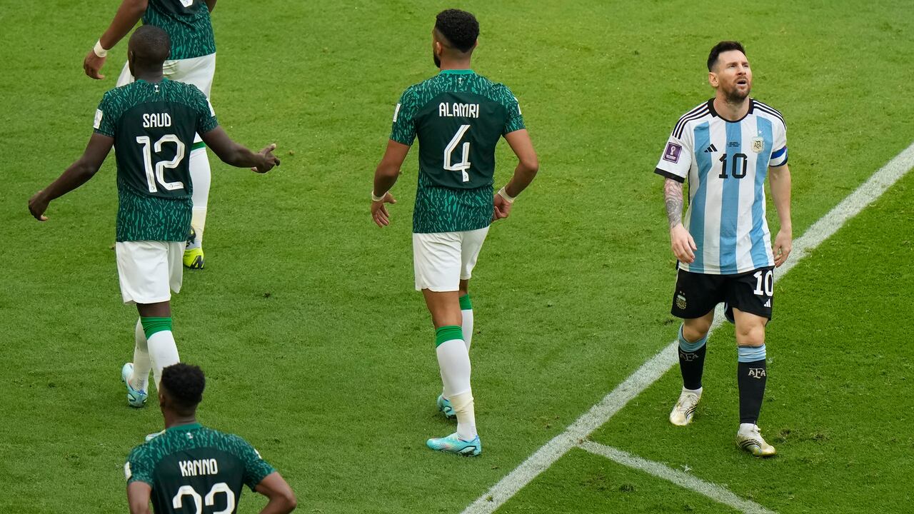 Argentina's Lionel Messi, right, reacts during the World Cup group C soccer match between Argentina and Saudi Arabia at the Lusail Stadium in Lusail, Qatar, Tuesday, Nov. 22, 2022. (AP Photo/Luca Bruno)