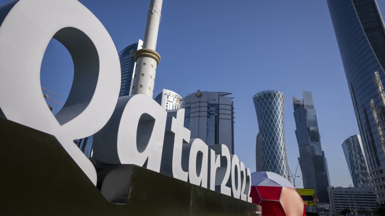 FILE - Branding is displayed near the Doha Exhibition and Convention Center in Doha, Qatar, Thursday, March 31, 2022. Qatar’s ruling emir has lashed out at criticism of the country over its hosting of the 2022 FIFA World Cup, complaining of an “unprecedented campaign” targeting the first Arab nation to hold the tournament. (AP/Darko Bandic, File)