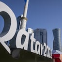 FILE - Branding is displayed near the Doha Exhibition and Convention Center in Doha, Qatar, Thursday, March 31, 2022. Qatar’s ruling emir has lashed out at criticism of the country over its hosting of the 2022 FIFA World Cup, complaining of an “unprecedented campaign” targeting the first Arab nation to hold the tournament. (AP Photo/Darko Bandic, File)