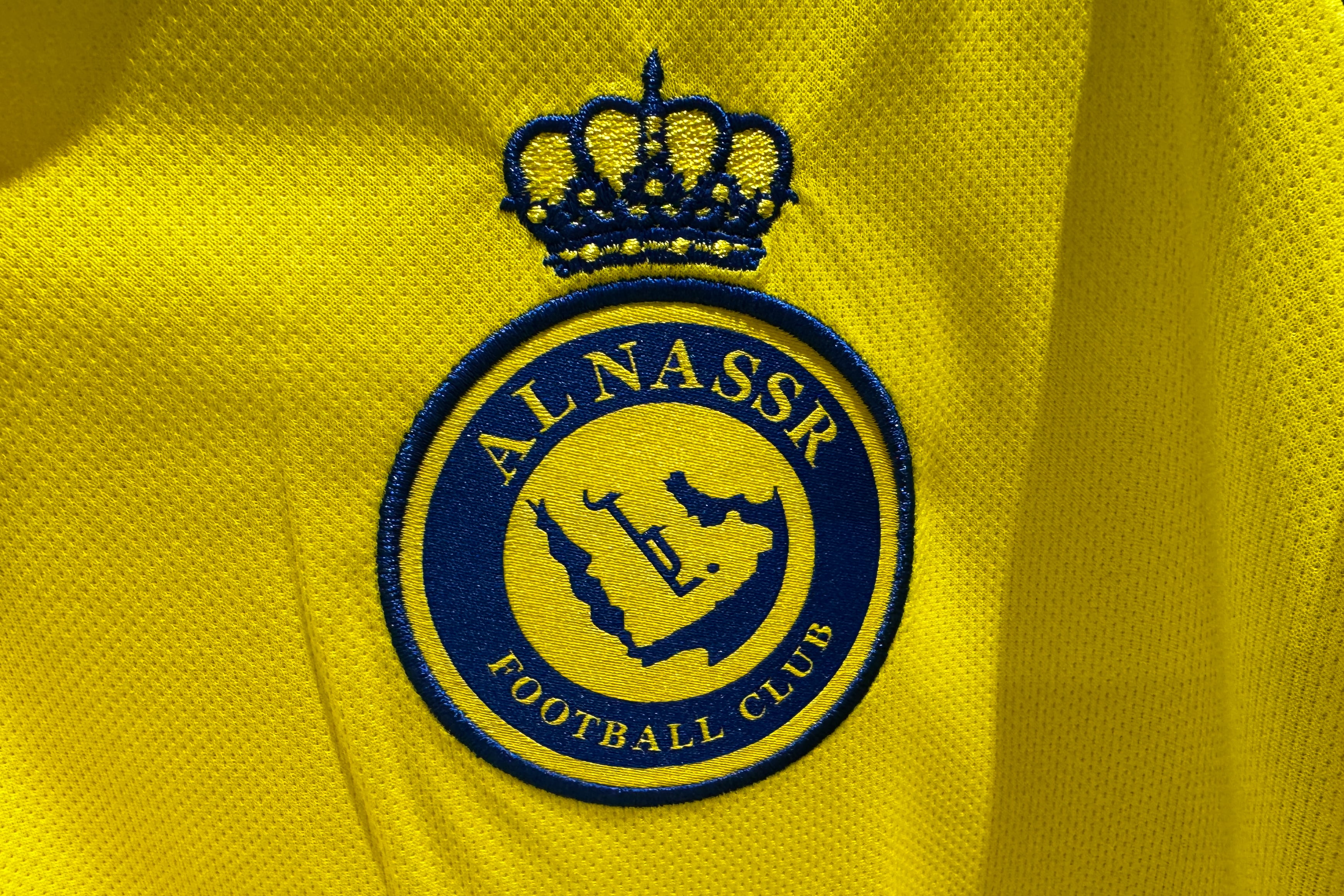 Al-Nassr logo is seen on a football jersey in this illustration photo taken in a store in Doha, Qatar on December 4, 2024. (Photo by Jakub Porzycki/NurPhoto via Getty Images)