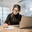 Young woman using laptop computer at home