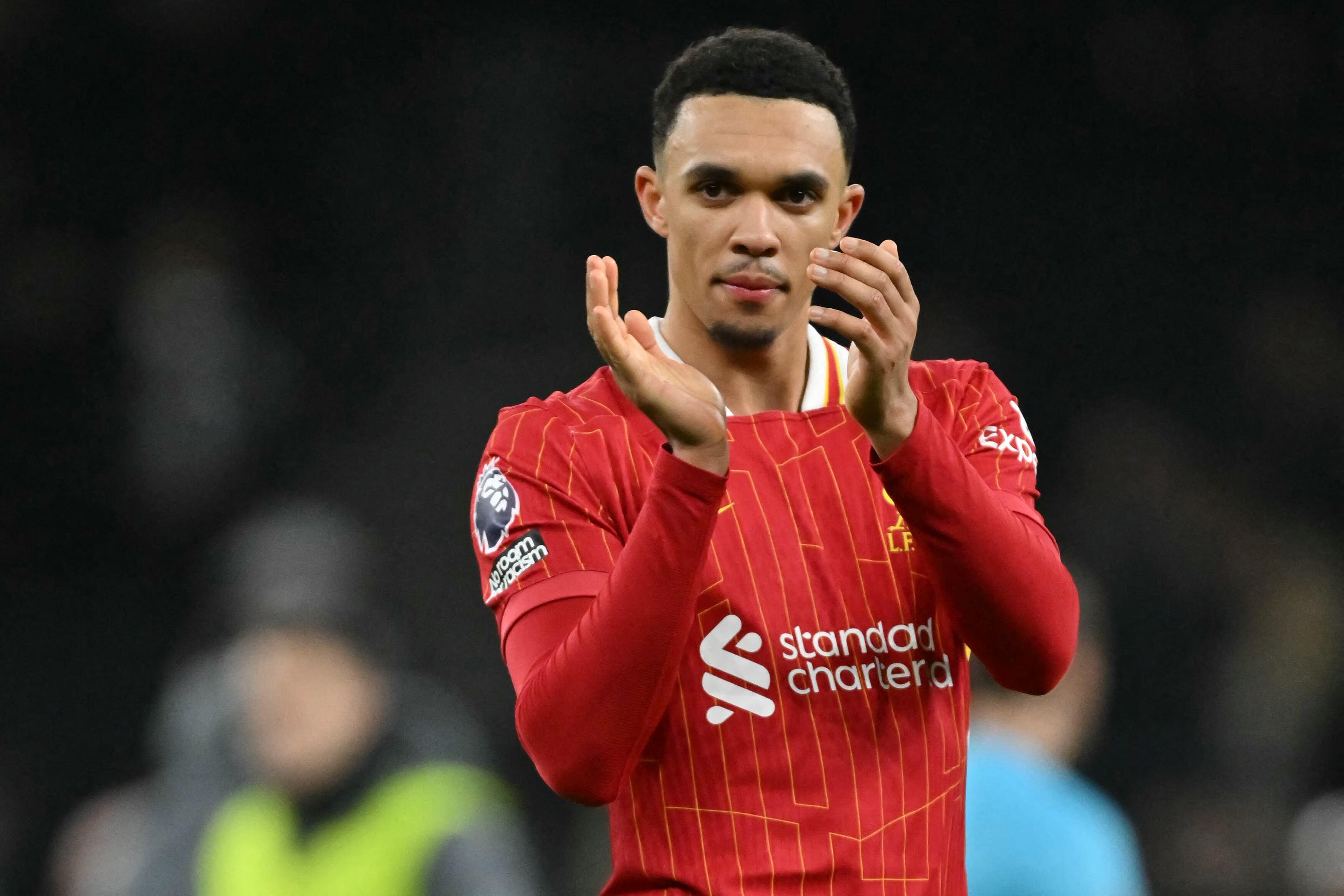 Liverpool's English defender #66 Trent Alexander-Arnold applauds fans on the pitch after the English Premier League football match between Tottenham Hotspur and Liverpool at the Tottenham Hotspur Stadium in London, on December 22, 2024. Liverpool won the game 6-3. (Photo by Glyn KIRK / AFP) / RESTRICTED TO EDITORIAL USE. No use with unauthorized audio, video, data, fixture lists, club/league logos or 'live' services. Online in-match use limited to 120 images. An additional 40 images may be used in extra time. No video emulation. Social media in-match use limited to 120 images. An additional 40 images may be used in extra time. No use in betting publications, games or single club/league/player publications. /