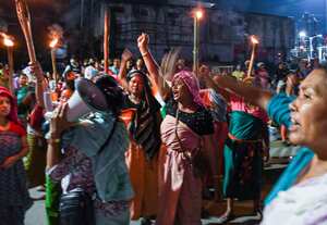 IMPHAL, MANIPUR, INDIA - 2023/07/16: Protesters from the women's activist group Meira Paibi chant anti-government and anti-police slogans during a road blockade in Imphal. The Meira Paibis are Meitei women who come from all sections of society in the Imphal Valley, are widely respected, they have a strong moral force. "Meira" means "light" and "Paibi" means "woman". These women are part of a unique movement called "Meira Paibi" that emerged in Manipur. They have protested against various problems such as social injustices, human rights violations, violence and discrimination. (Photo by Biplov Bhuyan/SOPA Images/LightRocket via Getty Images)