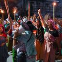 IMPHAL, MANIPUR, INDIA - 2023/07/16: Protesters from the women's activist group Meira Paibi chant anti-government and anti-police slogans during a road blockade in Imphal. The Meira Paibis are Meitei women who come from all sections of society in the Imphal Valley, are widely respected, they have a strong moral force. "Meira" means "light" and "Paibi" means "woman". These women are part of a unique movement called "Meira Paibi" that emerged in Manipur. They have protested against various problems such as social injustices, human rights violations, violence and discrimination. (Photo by Biplov Bhuyan/SOPA Images/LightRocket via Getty Images)