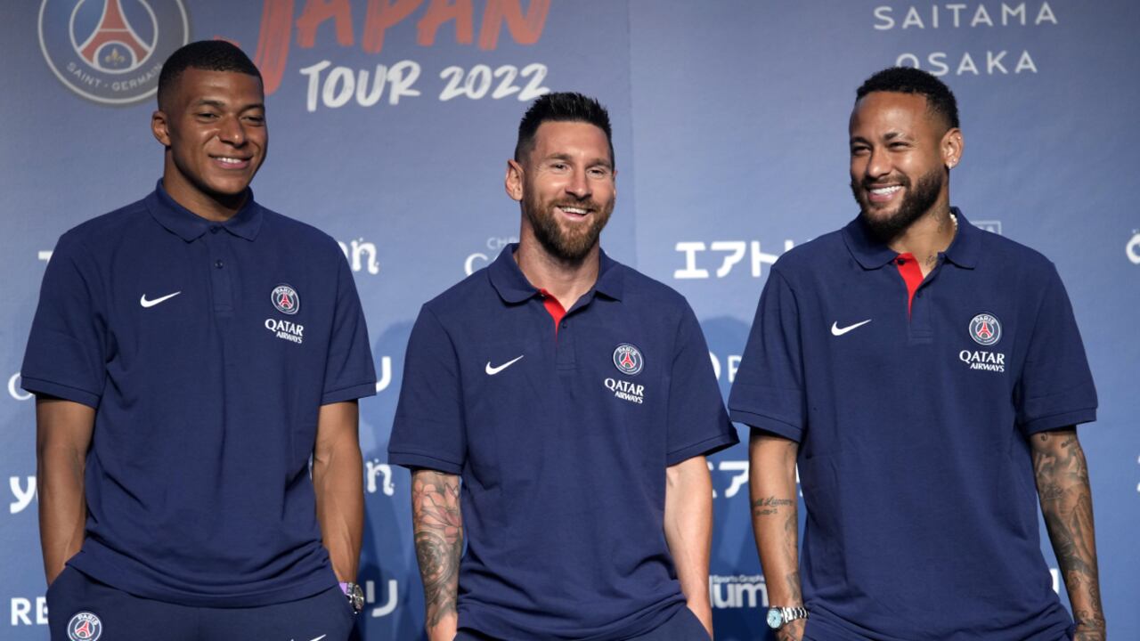 CORRECTS DATE - Paris Saint-Germain soccer players, Kylian Mbappe, left, Lionel Messi, center, and Neymar pose for photographers during a press conference in Tokyo Sunday, July 17, 2022. Paris Saint-Germain is in Japan for their pre-season tour.(AP/Shuji Kajiyama)