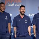 CORRECTS DATE - Paris Saint-Germain soccer players, Kylian Mbappe, left, Lionel Messi, center, and Neymar pose for photographers during a press conference in Tokyo Sunday, July 17, 2022. Paris Saint-Germain is in Japan for their pre-season tour.(AP Photo/Shuji Kajiyama)