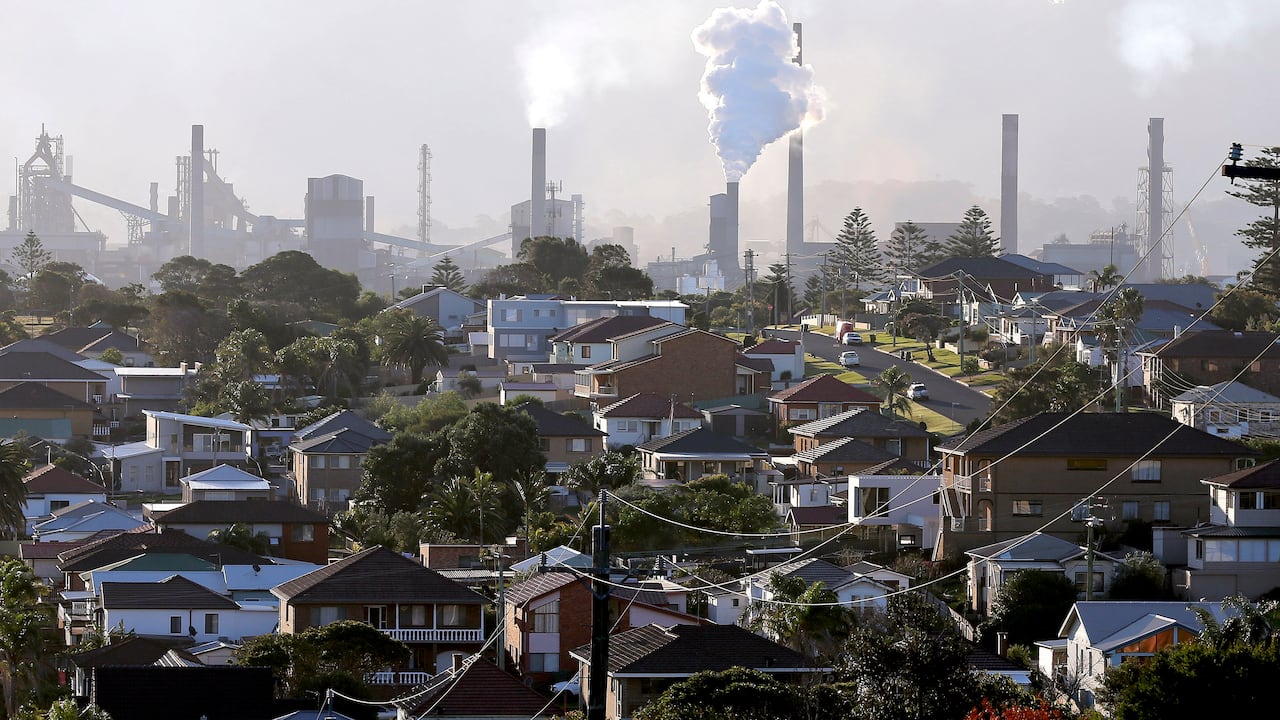 FILE - In this July 2, 2014, file photo, gasses billow from chimneys at a steel factory in Port Kembla, south of Sydney. Australia's Prime Minister Scott Morrison on Wednesday, April 21, 2021, proposed spending an additional 539 million Australian dollars ($417 million) on hydrogen and carbon sequestration projects in an announcement that bolsters his government's green credentials ahead of a climate summit to be hosted by U.S. President Joe Biden. (AP Photo/Rob Griffith, File)
