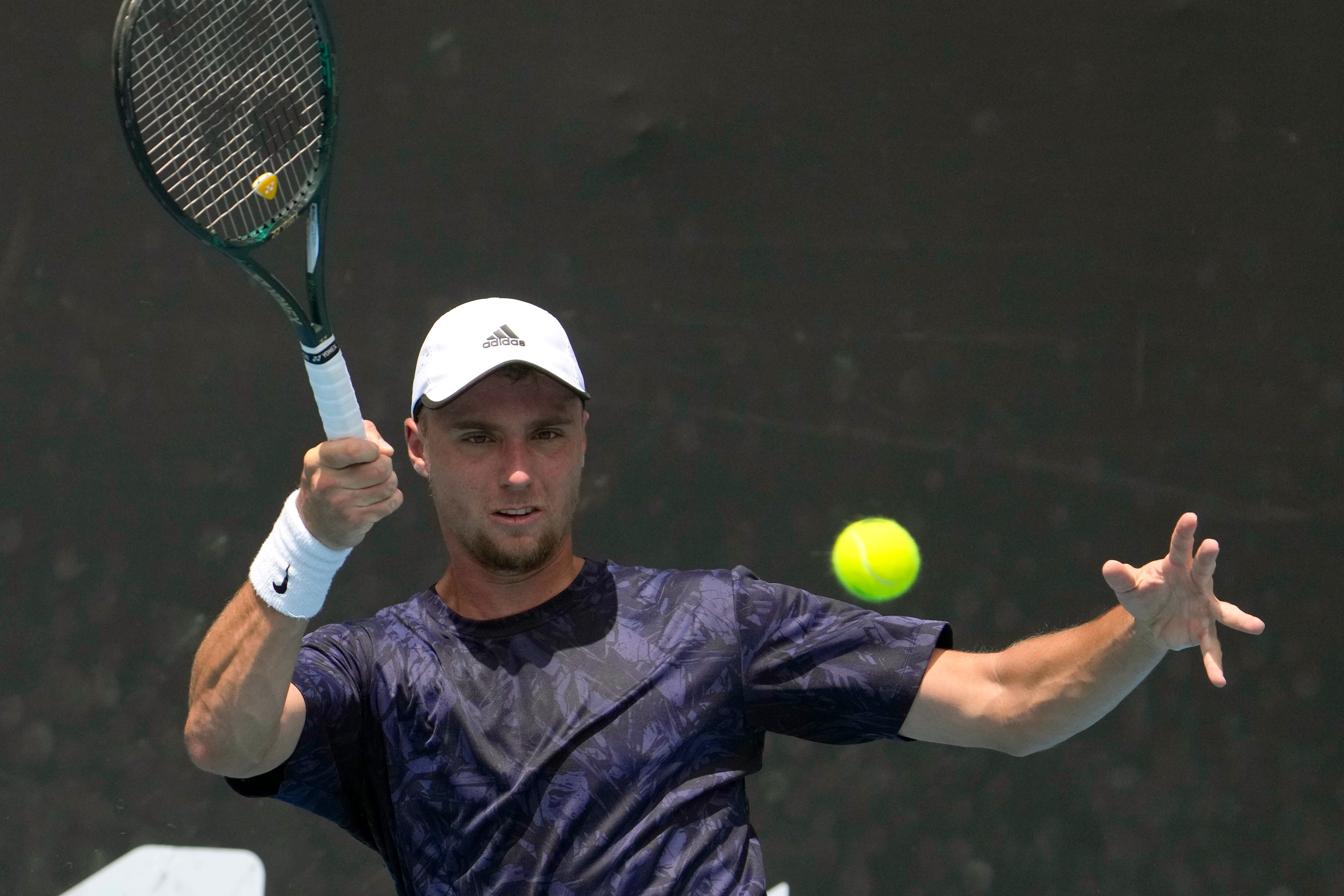 Oleksii Krutykh of Ukraine plays a forehand return to Diego Schwartzman of Argentina during their first round match at the Australian Open tennis championship in Melbourne, Australia, Tuesday, Jan. 17, 2023. (AP Photo/Ng Han Guan