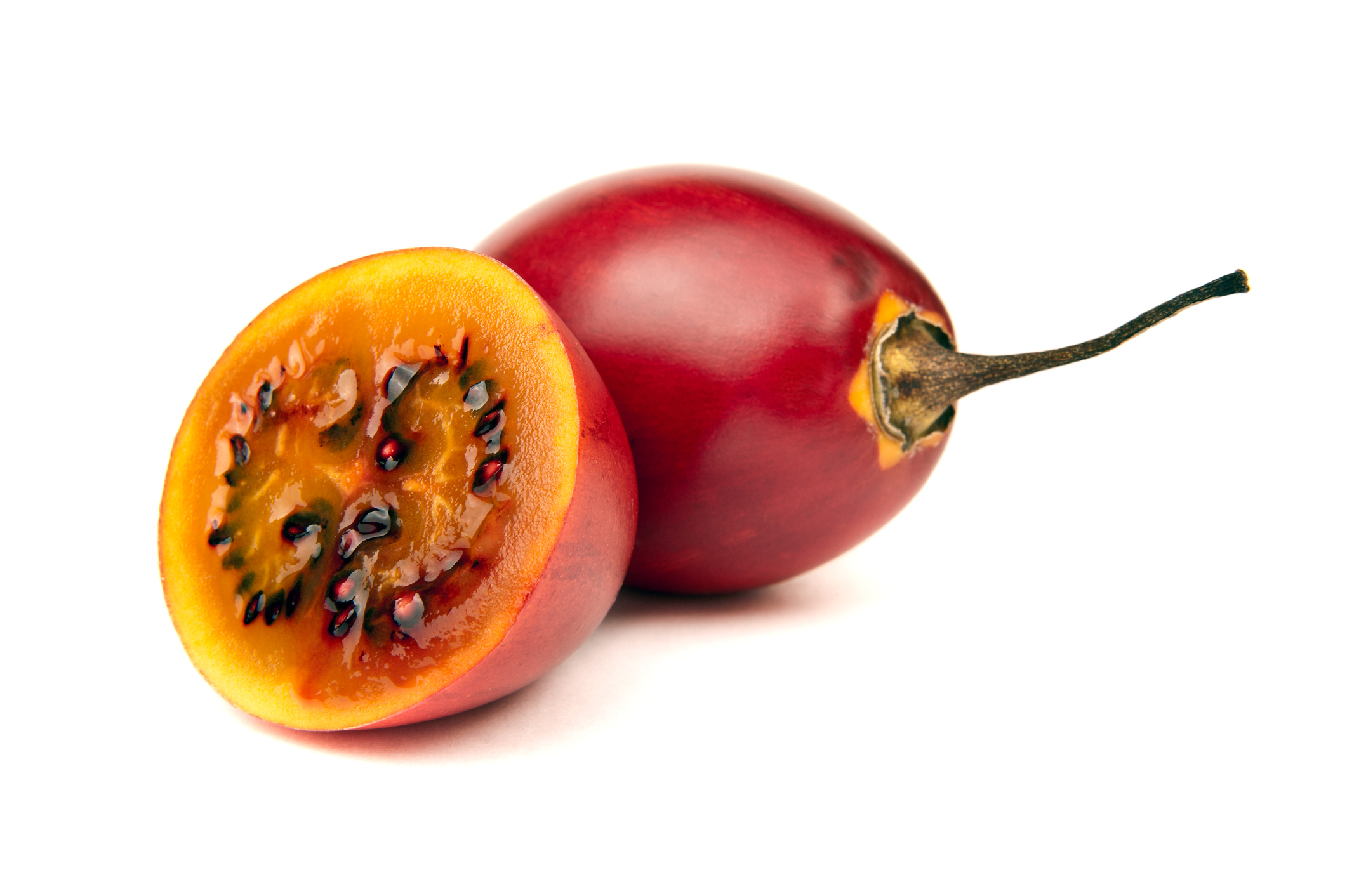 "Tamarillo, whole and cut half-and-half.Please see some similar pictures from my portfolio:"