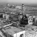 FILE - This April 26, 1986 file photo shows an aerial view of the Ukrainian Chernobyl nuclear plant, with damage from an explosion and fire in reactor four on that sent large amounts of radioactive material into the atmosphere. The vast and empty Chernobyl Exclusion Zone around the site of the world’s worst nuclear accident is a baleful monument to human mistakes. Yet 35 years after a power plant reactor exploded, Ukrainians also look to it for inspiration, solace and income. (AP Photo/ Volodymyr Repik)