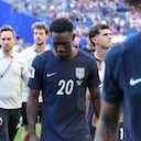 United States' Folarin Balogun (20) walks off the pitch after losing to Belgium in their World Cup round of 16 soccer match in Seattle, Monday, July 6, 2026. (AP Photo/Ted S. Warren)