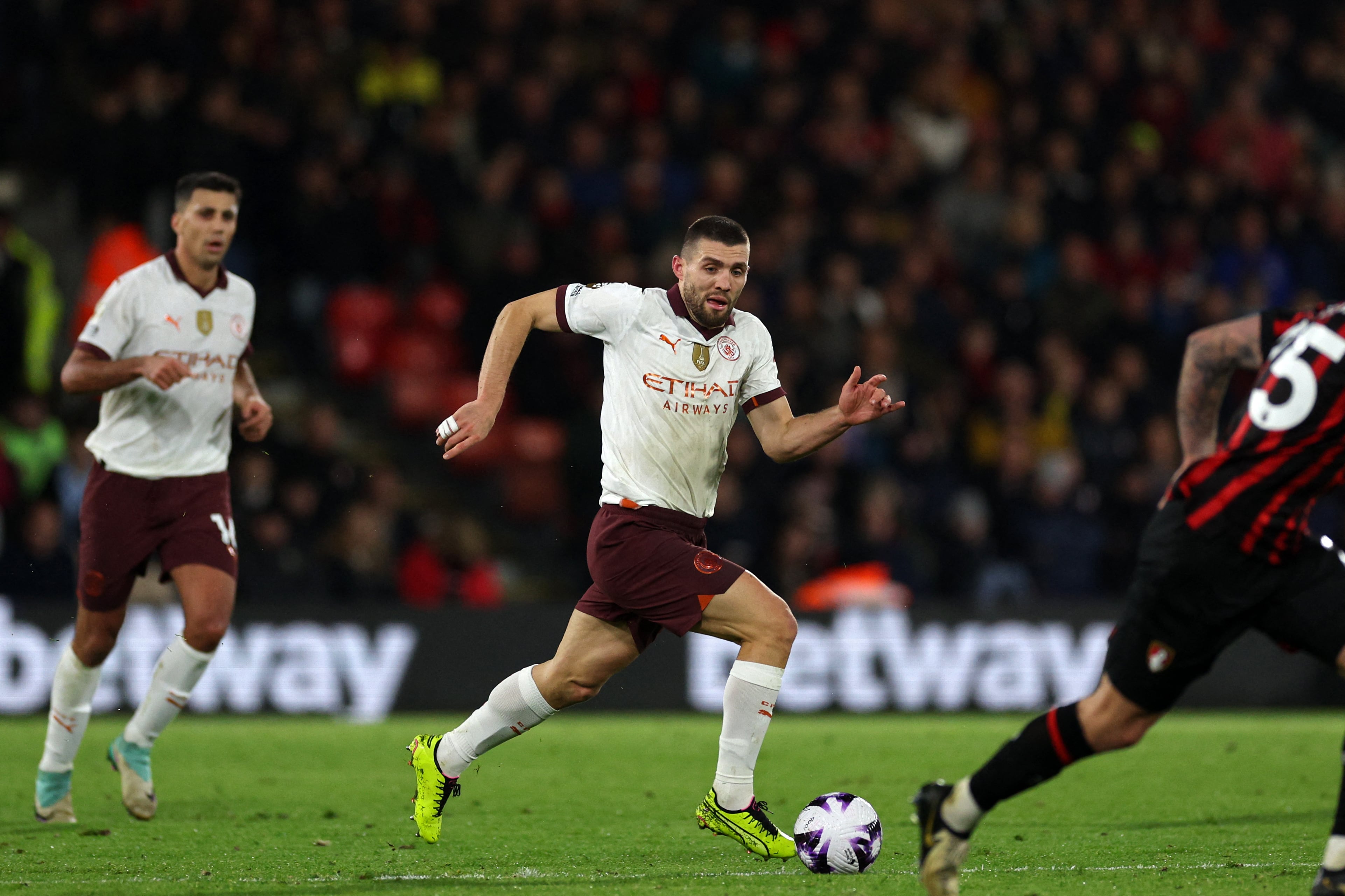Manchester City's Croatian midfielder #08 Mateo Kovacic runs with the ball during the English Premier League football match between Bournemouth and Manchester City at the Vitality Stadium in Bournemouth, southern England on February 24, 2024. (Photo by Adrian DENNIS / AFP) / RESTRICTED TO EDITORIAL USE. No use with unauthorized audio, video, data, fixture lists, club/league logos or 'live' services. Online in-match use limited to 120 images. An additional 40 images may be used in extra time. No video emulation. Social media in-match use limited to 120 images. An additional 40 images may be used in extra time. No use in betting publications, games or single club/league/player publications. /
