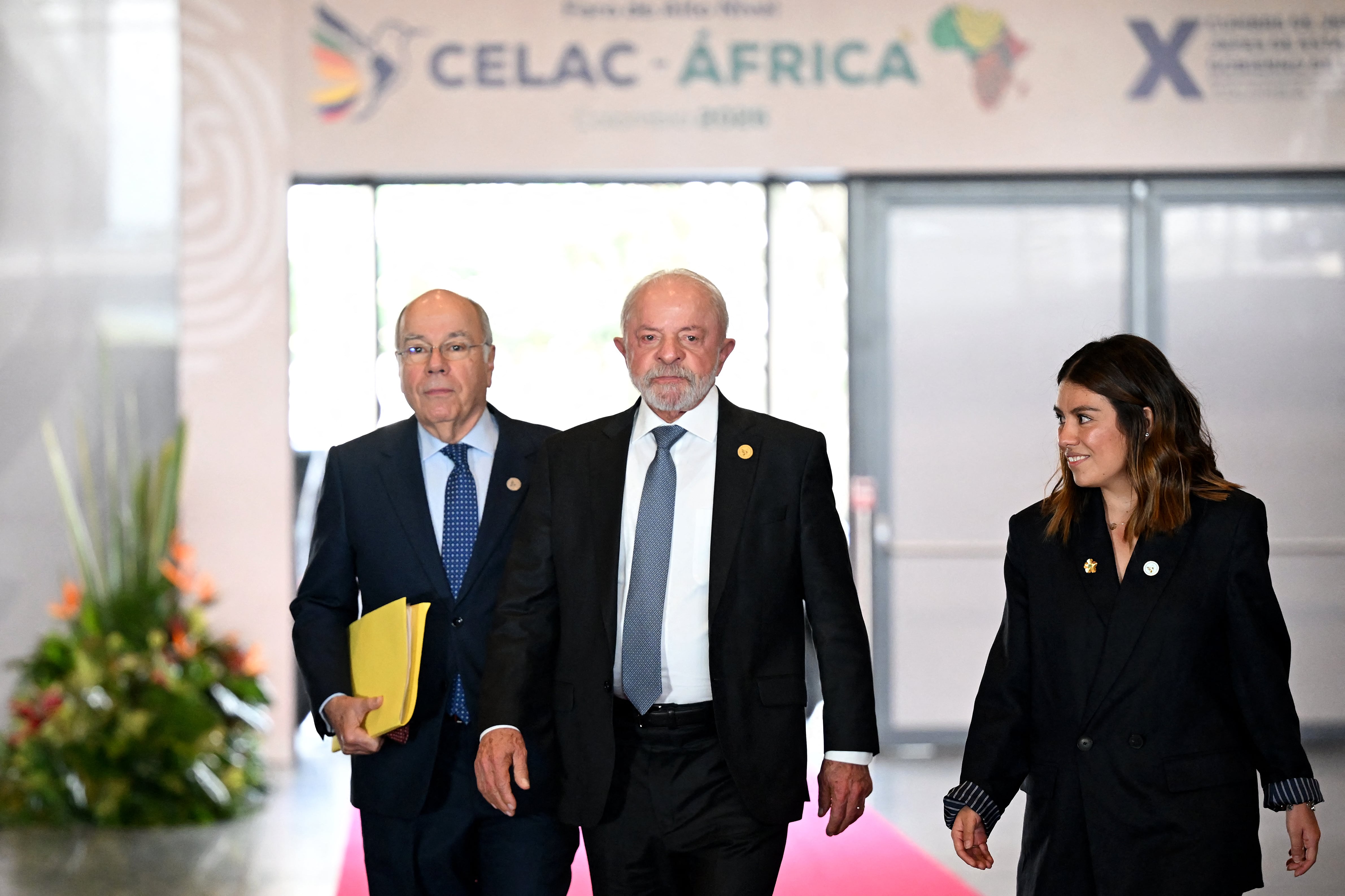 Brazil's President Luiz Inacio Lula da Silva (C) and Brazil's Foreign Minister Mauro Vieira arrive for the X Summit of Heads of State and Government, within the framework of the CELAC-Africa High-Level Forum in Bogota on March 21, 2026. (Photo by RAUL ARBOLEDA / AFP)