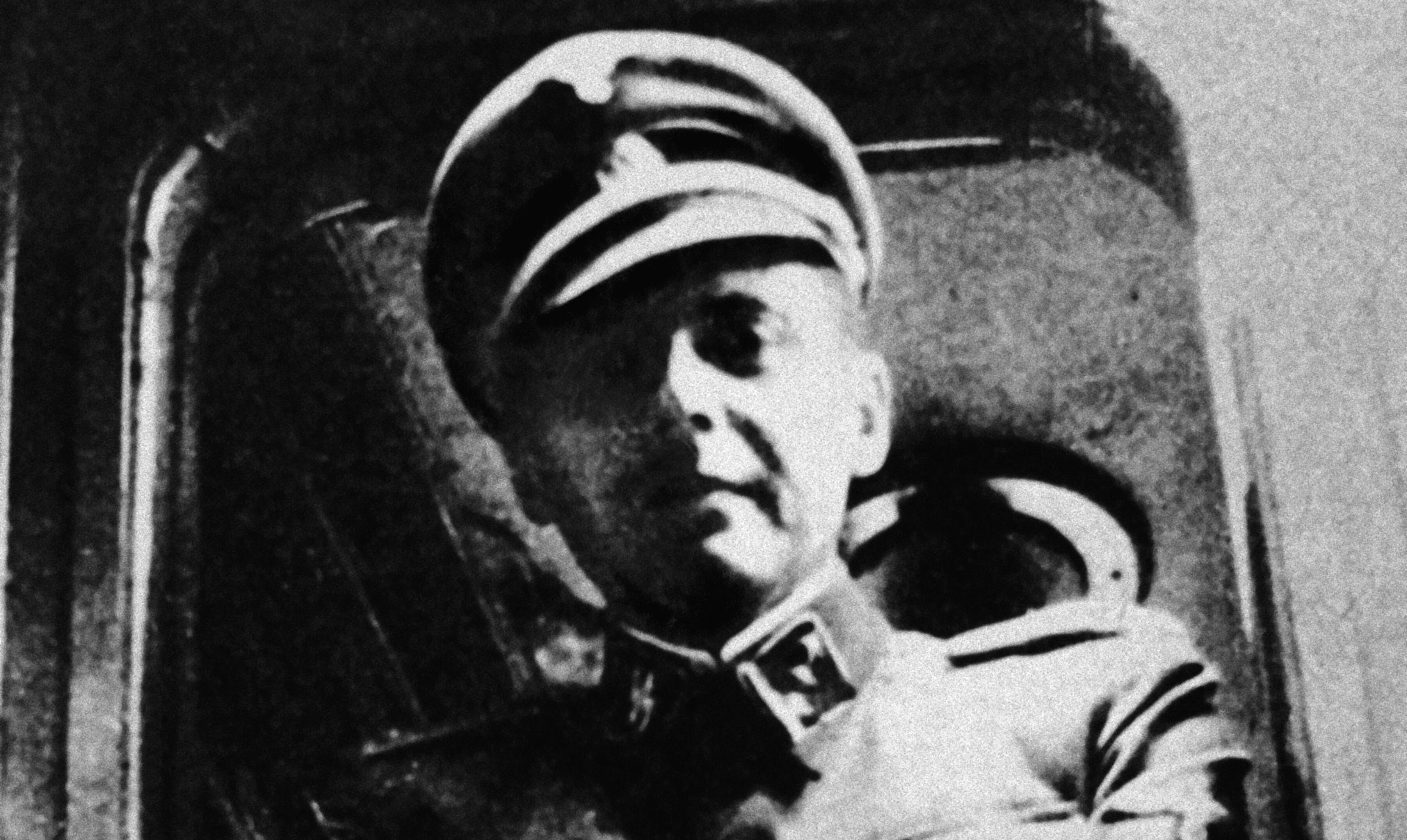 circa 1945:  German Nazi doctor and war criminal Josef Mengele (1911 - 1979) standing at a train window his SS uniform.  (Photo by Hulton Archive/Getty Images)