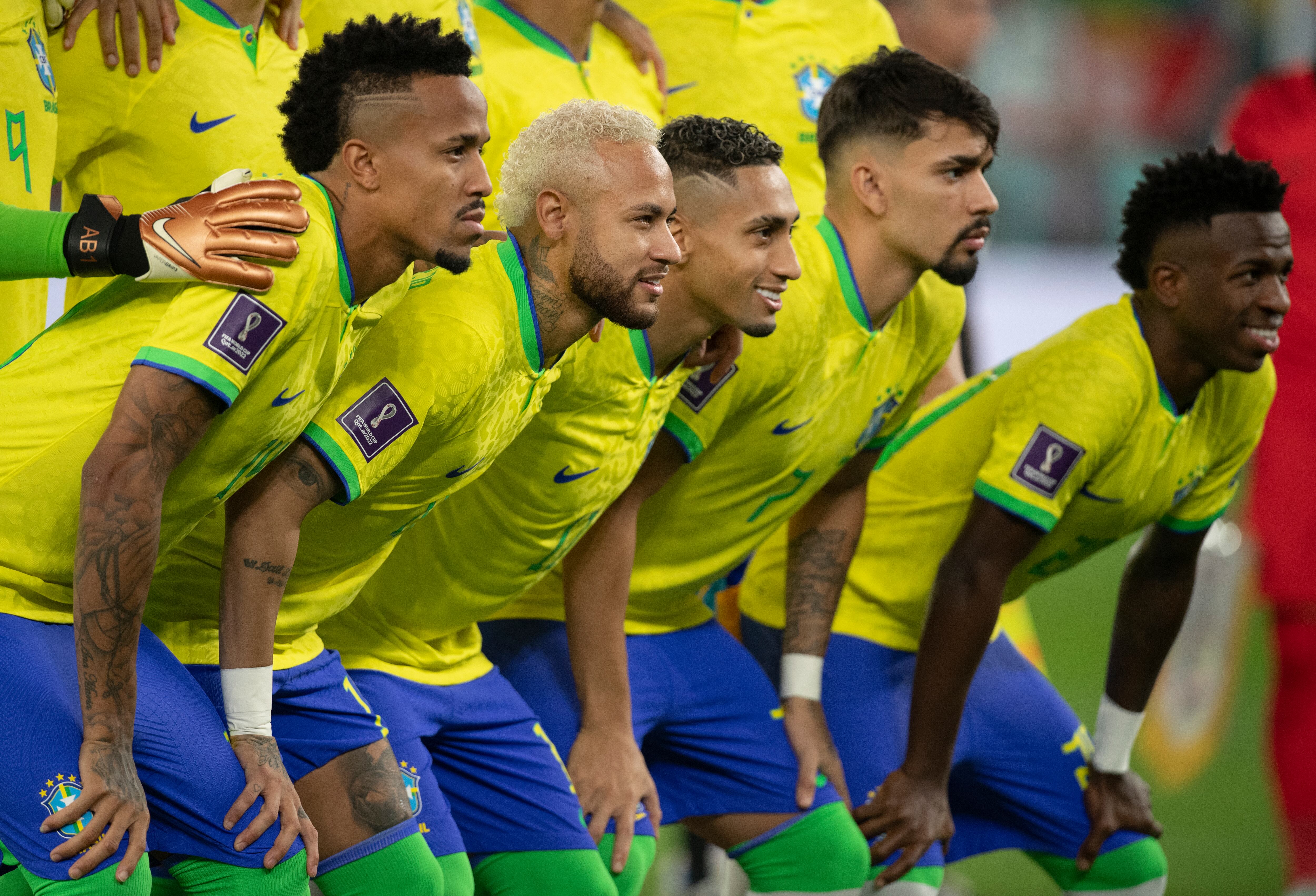 DOHA, QATAR - DECEMBER 05: Eder Militao, Neymar, Raphinha, Lucas Paqueta and Vinicius Junior of Brazil line up ahead of the FIFA World Cup Qatar 2022 Round of 16 match between Brazil and South Korea at Stadium 974 on December 5, 2022 in Doha, Qatar. (Photo by Visionhaus/Getty Images)