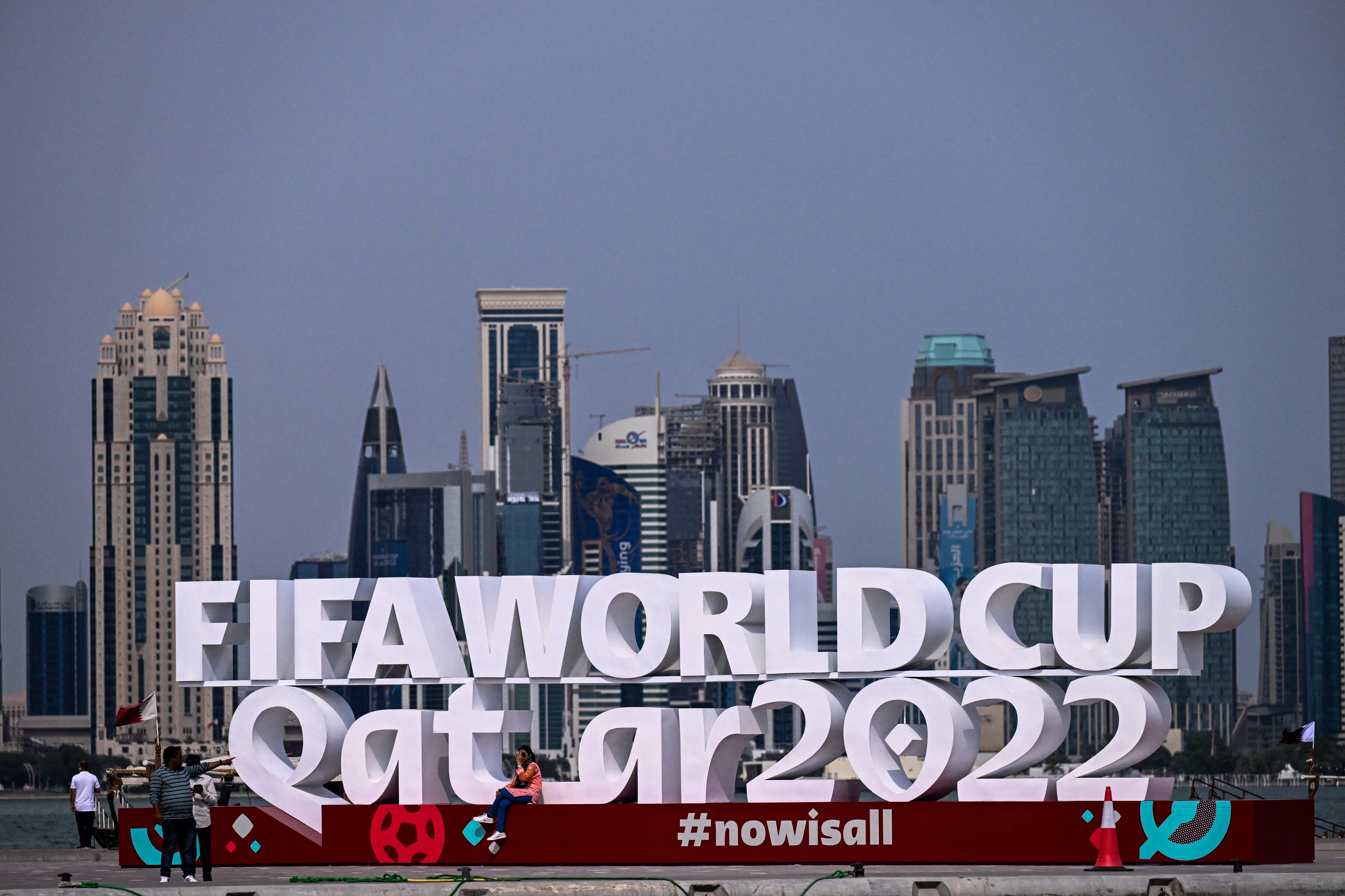 People visit the corniche adorned with a FIFA sign in Doha on November 5, 2022, ahead of the Qatar 2022 FIFA World Cup football tournament. (Photo by Jewel SAMAD / AFP)