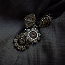 Antique jewellery and antique wooden box in dark textured background