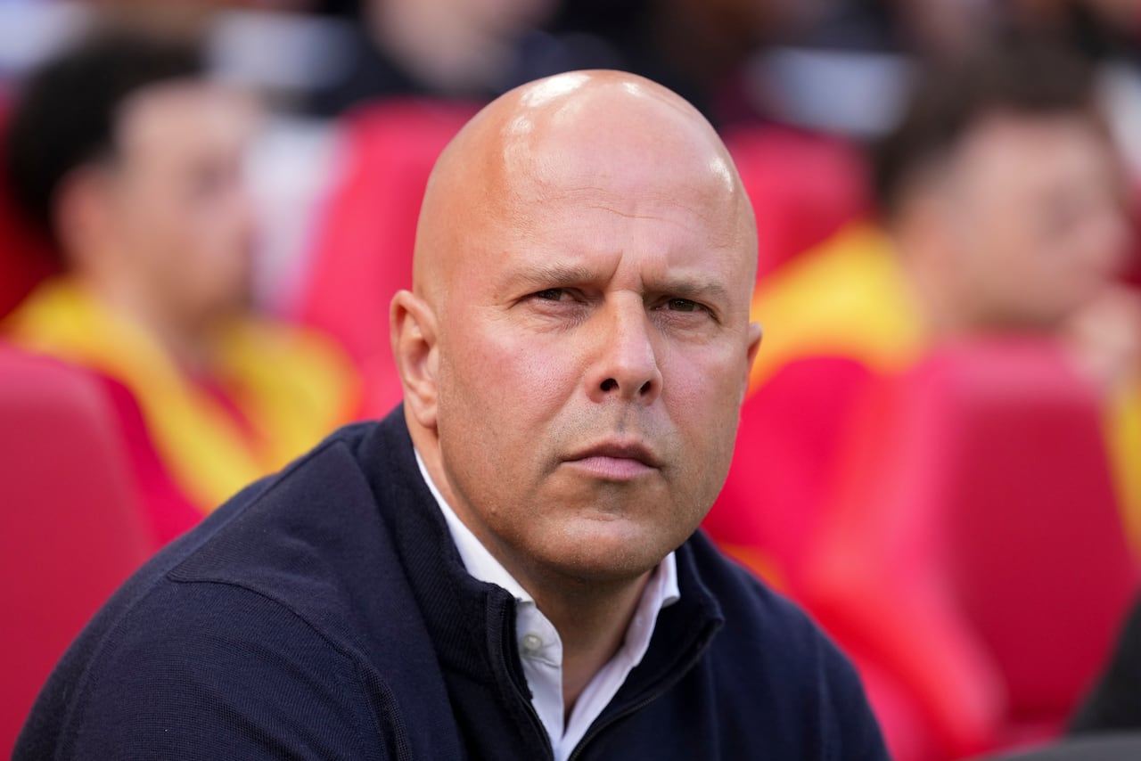 Liverpool's manager Arne Slot takes his seat before the English Premier League soccer match between Liverpool and Tottenham Hotspur at Anfield in Liverpool, England, Sunday, April 27, 2025. (AP Photo/Jon Super)