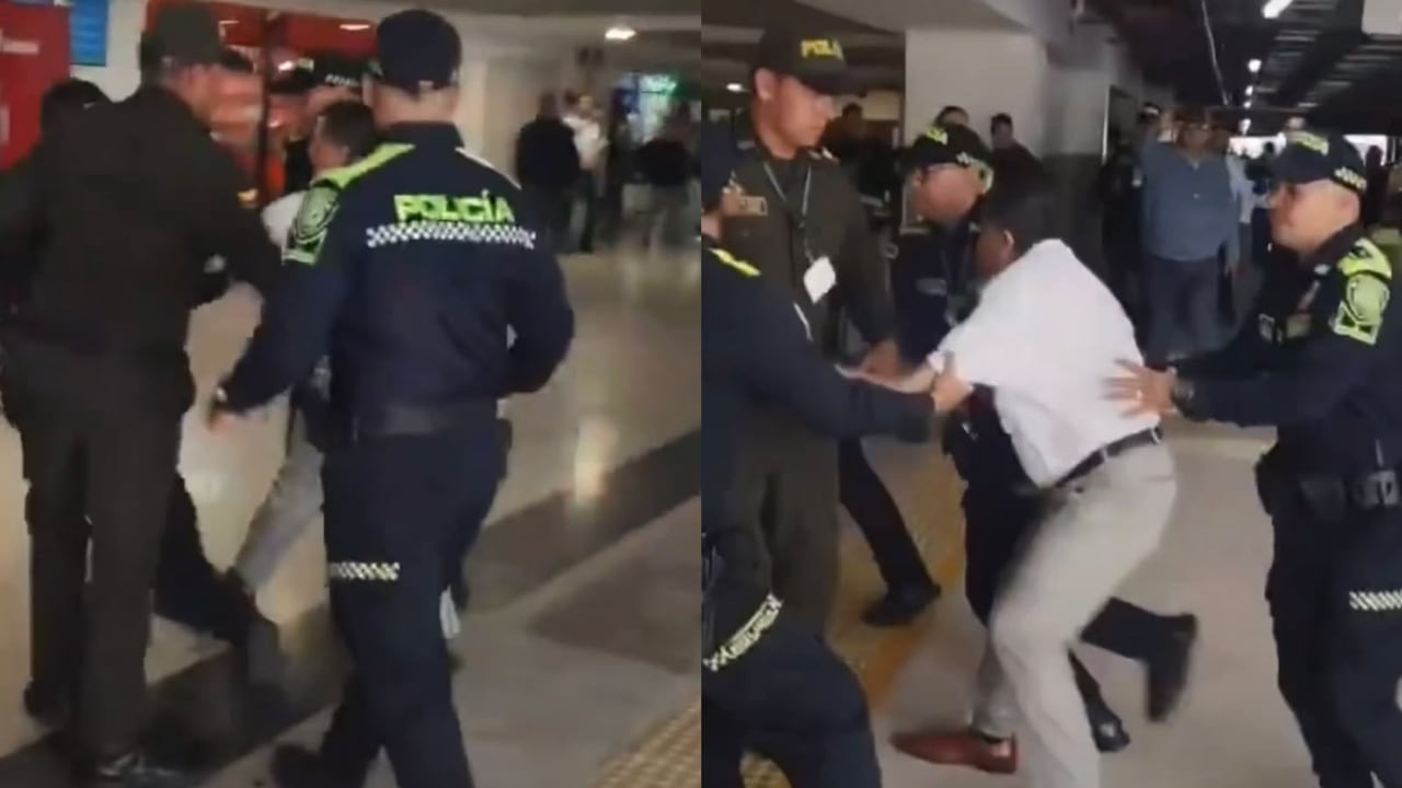 Hugo Ospina, líder de taxistas, siendo conducido por la Policía de Bucaramanga para imponerle un comparendo.