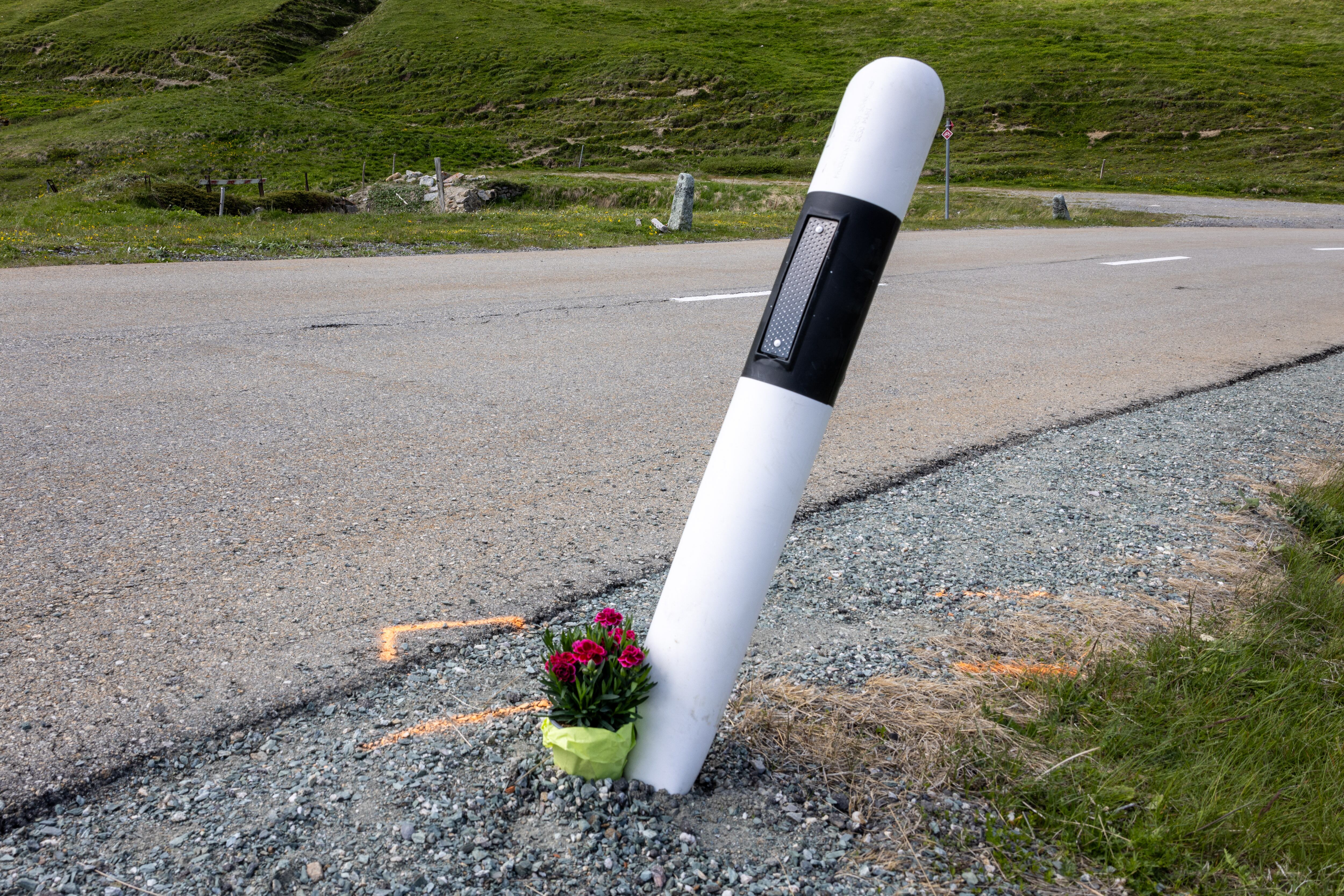 Flowers are seen on June 16, 2023 at the curve were Swiss rider Gino Maeder fell during a high-speed descent of the fifth stage of the Tour of Switzerland cycling rave above La Punt-Chamues-ch, far-eastern Switzerland. Gino Maeder, 26, has died from the injuries he sustained when he plunged into a ravine his team Bahrain-Victorious said on June 16, 2023. Maeder fell during a high-speed descent on the fifth stage between Fiesch and La Punt on June 15, 2023 after an exhausting day marked by three ascents over 2,000 metres altitude. (Photo by ARND WIEGMANN / AFP)