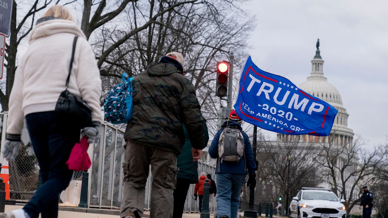 Trump supporters walk past the Dome of the Capitol Building in Washington, Wednesday, Jan. 6, 2021. (AP Photo/Andrew Harnik)