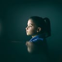 girl using computer at night