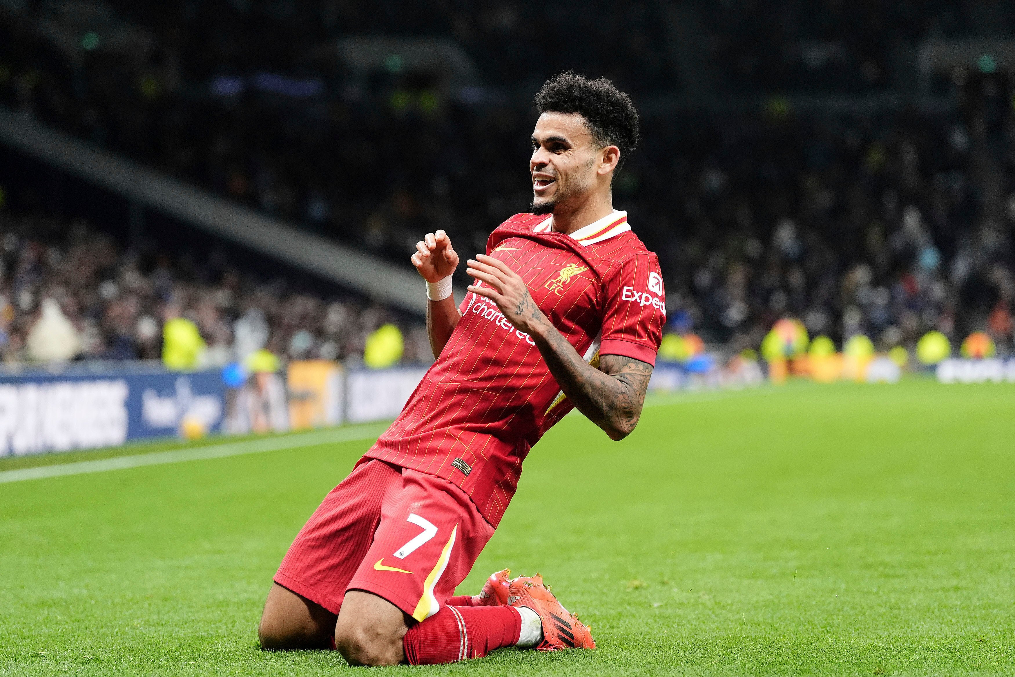Liverpool's Luis Diaz celebrates scoring his side's sixth goal during the English Premier League soccer match at the Tottenham Hotspur Stadium, London, Sunday Dec. 22, 2024. (Adam Davy/PA via AP)