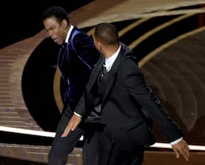 HOLLYWOOD, CALIFORNIA - MARCH 27: (L-R) Chris Rock and Will Smith are seen onstage during the 94th Annual Academy Awards at Dolby Theatre on March 27, 2022 in Hollywood, California. (Photo by Neilson Barnard/Getty Images)